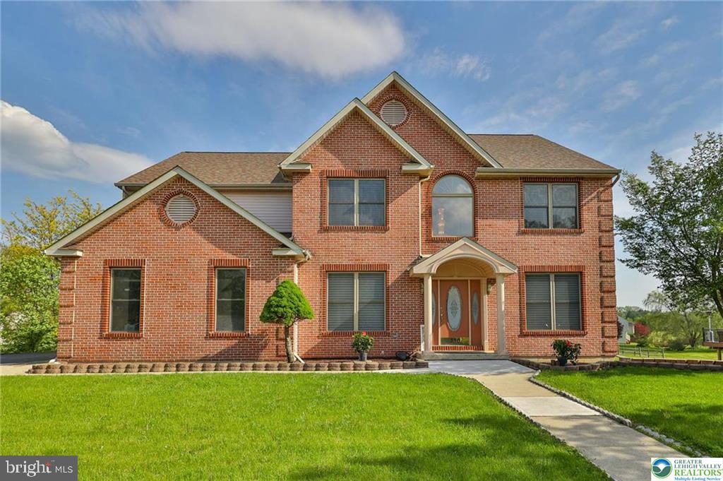 First time ever offered in the highly sought-after Heatherfield subdivision of Parkland. This elegant brick-front Montclair model is beautifully set on a nearly half-acre lot in one of the Lehigh Valley’s most desirable locations. A covered front porch welcomes you into a dramatic 2-story foyer and impressive family room with soaring ceilings, gas fireplace, and scenic backyard views. The fully renovated kitchen is a true showpiece, featuring modern finishes, center island, built-in walk-in pantry, and a wall of windows that fills the kitchen and main living areas with bright and cheery natural light. The main level also offers a flexible office/den with an adjacent full bathroom, ideal for guests, work-from-home needs, or possible future bedroom use. Upstairs, you’ll find 4 spacious bedrooms, second-floor laundry, a dual-sink hall bath, and a generously sized primary suite with tray ceiling, walk-in closet, and spa-like bath with soaking tub and separate shower. The bright finished daylight lower level adds exceptional living space with a full bathroom, expansive recreation area, and an additional finished room perfect for a gym, hobby room, office, or private retreat. Outdoor living is equally inviting with a huge deck, oversized backyard, side-entry 2-car garage, side entry door, extended driveway, and expansive concrete patio enhanced by decorative white post lights that add charm and a relaxing ambiance for evening enjoyment and outdoor gatherings. Notable updates include a brand-new roof, Rheem water heater, Rheem water softener, newer flooring, renovated kitchen, and more. No HOA. A rare win-win opportunity that truly checks all the boxes for today’s buyers, offering the perfect blend of location, layout, comfort, and convenience for modern living.