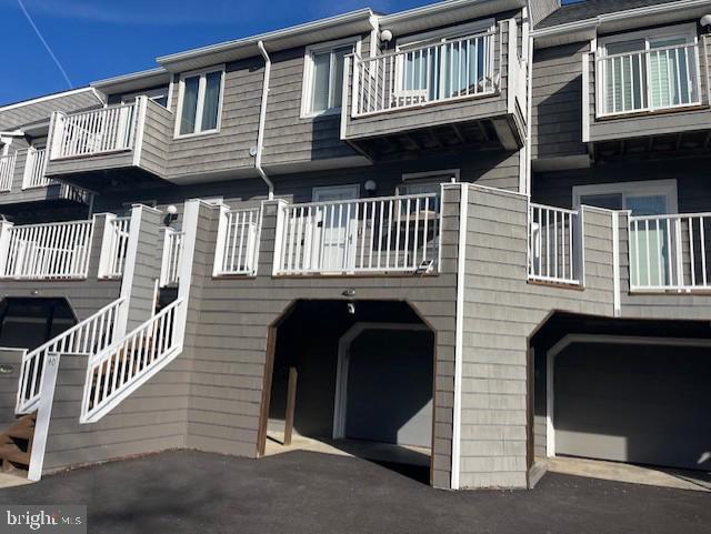 Welcome to the wonderful world of Harbour Island.  This beautiful, fully furnished townhouse is overlooking the pool and the marina.  This is the home of the famous White Marlin Open.  You can see the weigh scales from the deck of the unit.  The kitchen has granite countertops and stainless steel appliances.  In the dining area there is a wet bar complete with wine refrigerator and ice maker.  There is luxury vinyl flooring in the dining and living room area.  There is a wood burning fireplace for ambiance in the living room surrounded by beautiful built-in cabinets on both sides.  Two large bedrooms upstairs both have balconies for a of view sunrise and sunsets.  All bathrooms are newly updated.  In the garage area there is a large bonus room with bunk beds and a double bed.  Connecting to that bedroom is a full bathroom.  There are two sets of washer and dryers.  One in the garage area and one located on the second floor near the bedrooms.  Also, the unit is equipped with a water softener system that helps with hard water and calcium. 
 This is a 'must see" unit to appreciate how spectacular it is.  Boat slips available for purchase.