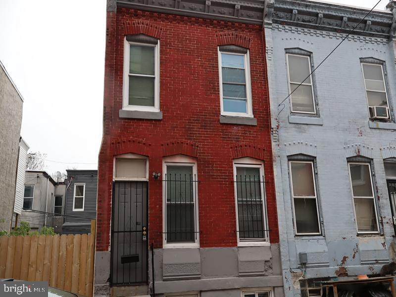 Great two-story brick rowhome offering a spacious open floor living room, dining room, and kitchen with walk-out access to a fenced rear yard. The upper-level features three bedrooms and one full bathroom. Located in the North Philadelphia neighborhood, this residence was constructed in 1915 and contains approximately 1,112 square feet of living space, per public records. Situated just blocks from Broad Street, the property offers convenient access to public transportation, major automobile routes, and Center City Philadelphia.