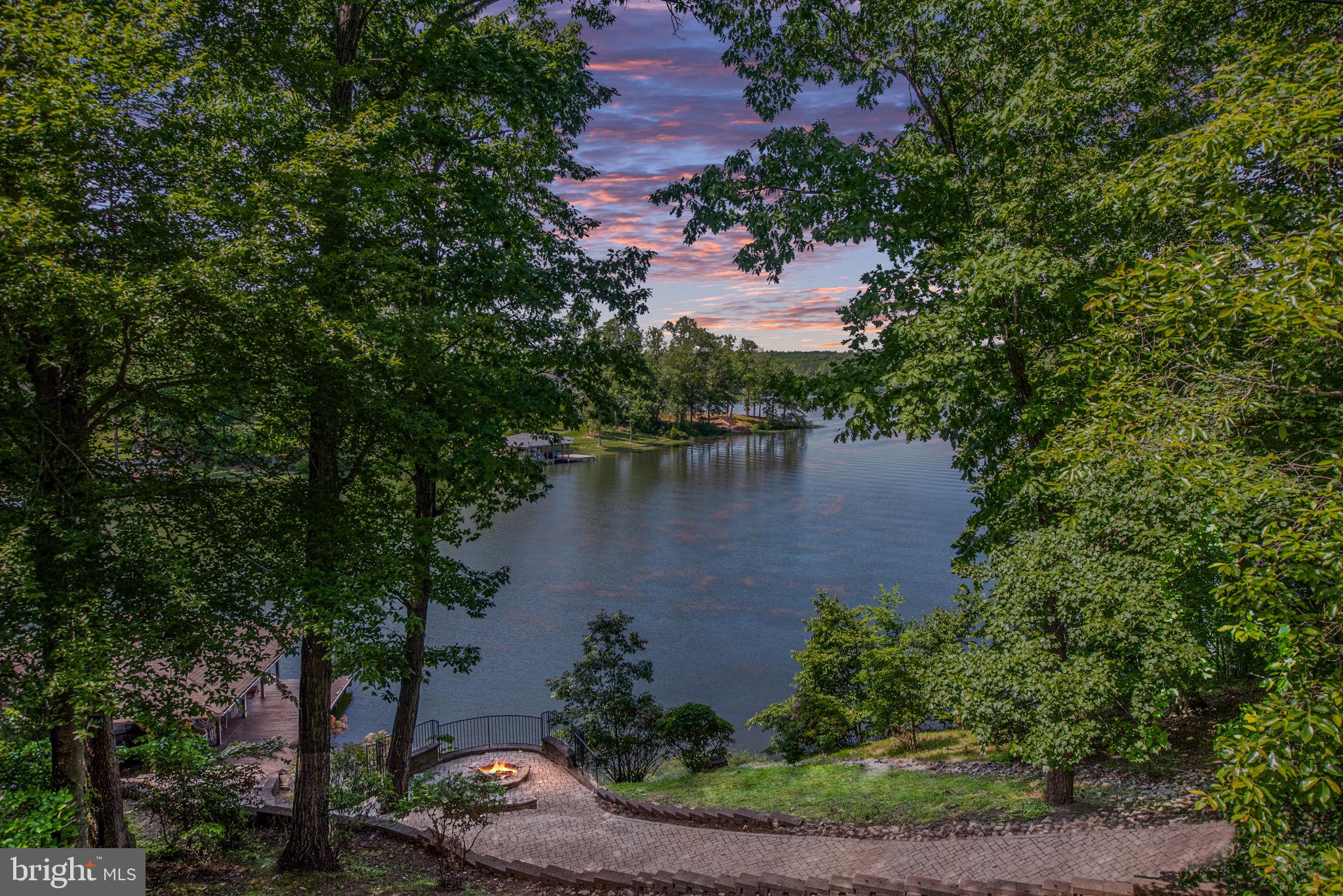 LOCATION & WATERFRONT!
An exceptional and rare opportunity to own a stunning waterfront home on the public side of Lake Anna! Perfectly situated in a central location, this property boasts approximately 200 feet of deep-water shoreline in a peaceful no-wake zone, offering views of the Rose Island area of Lake Anna. 

The sellers have thoughtfully lowered the price to give new owners the freedom to choose their own finishes, colors, and design preferences on upgrades/updates as they deem fit. Home is fully functional as it is now. 

This extraordinary lakefront gem is a rare find and features 6 spacious bedrooms, 5 full bathrooms, and 1 half baths, all complemented by the convenience of a private elevator.

The main level offers a bright and open floor plan with a cozy sitting area and gas fireplace, an open-concept kitchen, and incredible water views. You’ll also find a main-level laundry area, three bedrooms, and 2.5 baths. Step outside onto the expansive full-length deck, complete with a screened-in porch, perfect for relaxing or entertaining.

Take the stairs or elevator down to the lower level, which opens to a spacious game and lounge area—billiard table included! Each wing of the lower level has its own bedrooms, bathrooms, and an additional laundry area for ultimate convenience.

Outside, follow the paver path down to the lakeside patio and firepit, or continue to the boathouse. The boathouse features two boat slips with lifts, a covered seating area, and a storage shed, offering everything you need for lake life.

Don’t miss your chance to own this unique piece of Lake Anna paradise—opportunities like this are few and far between!
