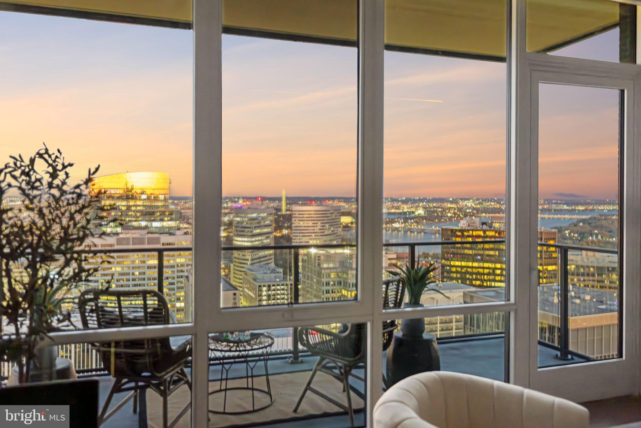Welcome to the pinnacle of luxury living at The Pierce, where this exceptional residence stands as the premier offering in the building. Perched on 24th floor, this exclusive unit provides direct, sweeping views of the Potomac River, the DC skyline, and Washington’s iconic monuments. The sophisticated layout of this 1,323-square-foot residence delivers an unrivaled blend of style and comfort. Expansive floor-to-ceiling windows and added ceiling heights on this floor frame panoramic city and river vistas, while the private 15’ balcony extends the living space outdoors. 

Imagine sipping wine as you take in the sun glistening off the Washington Monument or hosting intimate gatherings as the sun sets with the city as your backdrop. In the spring, marvel at the breathtaking cherry blossoms that blanket the Tidal Basin in clouds of pink and white. Come summer, experience the awe-inspiring spectacle of Fourth of July fireworks lighting up the night sky over the National Mall. 

Every inch of this home is designed to the highest standards. The chef-inspired kitchen is equipped with Thermador appliances and Snaidero cabinetry, accented by sleek quartz countertops and an island breakfast bar perfect for both meal preparation and socializing. Entertain in style with a built-in wine refrigerator & entertaining space illuminated by gallery-quality lighting. Hand-scraped hickory floors run throughout, lending warmth and elegance to every room. 

The private quarters of this residence are equally extraordinary. Spacious bedrooms serve as tranquil retreats, each offering river and skyline views. The owner’s suite is a masterpiece of luxury, featuring an exquisite marble bathroom with heated floors for ultimate comfort. The generous walk-in and second closet are beautifully outfitted and easily customizable to suit your needs. Every detail, from the premium fixtures to the carefully selected finishes, creates an atmosphere of understated opulence. A secondary bedroom offers an adjacent full bath and a double closet. The separate laundry room features a full-size washer and dryer with a wash sink. With two full-size garage parking spaces, a separate storage room, and on-site indoor bike storage, your day-to-day living is as seamless as it is sophisticated. 

Living at the Pierce means enjoying access to a host of exclusive amenities that enhance both convenience and lifestyle. The 24-hour concierge service is at your disposal, offering white-glove assistance for all your needs, ensuring every day feels like a luxurious retreat. The luxe club room, 65-foot resort-style pool, and two-story fitness center provide the perfect venues for relaxation and recreation. The rooftop entertainment terrace, complete with lounge areas, cooking spaces, and scenic views, offers an outdoor sanctuary amidst the urban environment. 

Stepping out from Pierce’s luxurious, hotel-style lobby, you’re just minutes from the Rosslyn Metro, making it simple to access the best of Washington, DC. Whether you're heading to Georgetown for a world-class dinner, catching a lecture downtown, or attending a performance at the Kennedy Center, the finest of DC culture is at your fingertips. For daily conveniences, Safeway is located just next door, and the neighborhood offers an exciting mix of dining and wellness options. Outdoor enthusiasts will love the nearby Freedom Park, Gateway Park, and adjacent Rosslyn Highlands Park. This home represents a singular opportunity to experience a life of luxury, comfort, and convenience, all in a location that offers the very best of urban sophistication. Experience Arlington’s Most Elevated Address—a residence that is truly one-of-one.