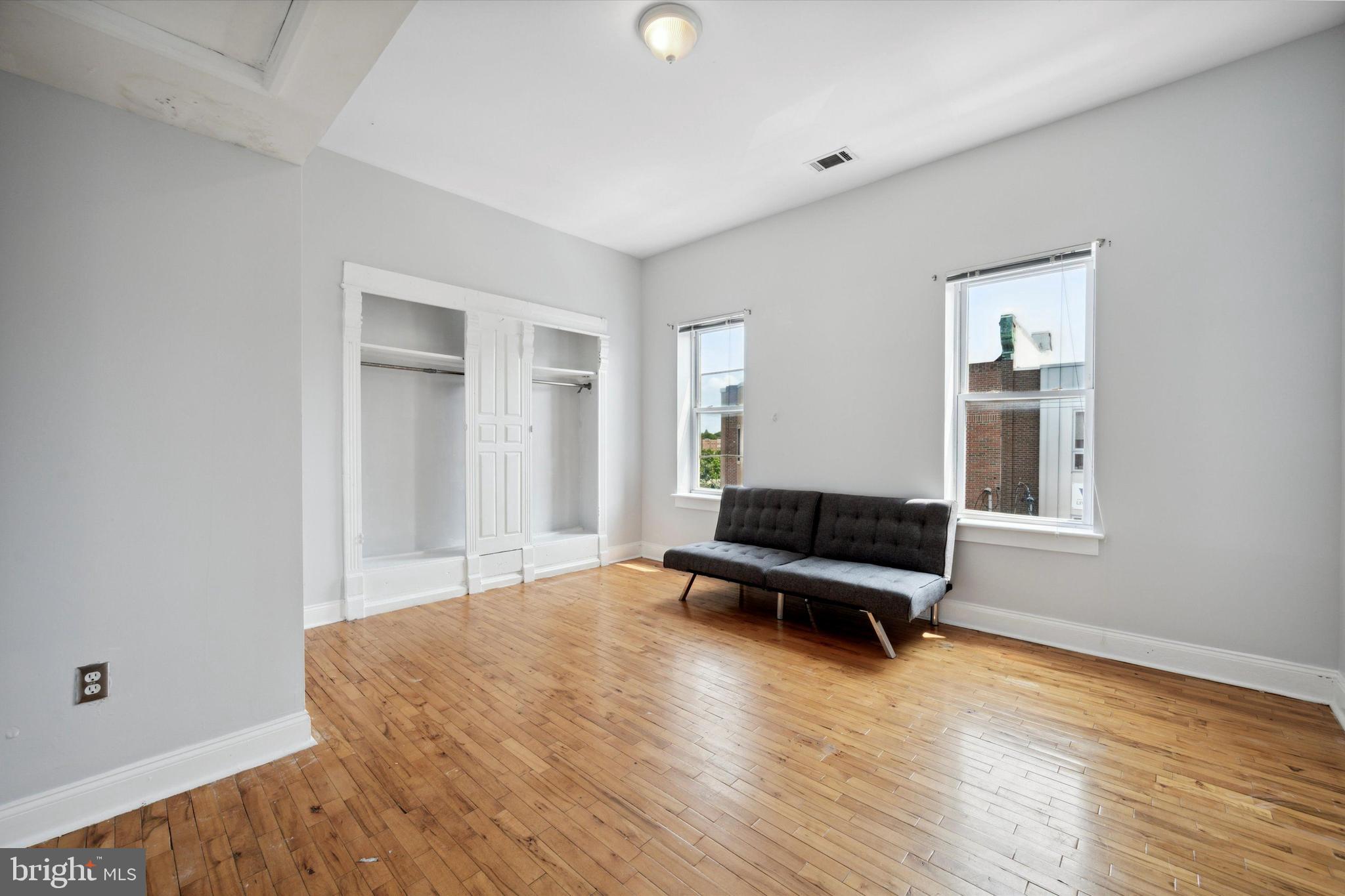 Welcome to 1852 N 17th Street, a spacious 8-bedroom, 3-bathroom investment property offering approximately 2,500 square feet of living space in one of Temple University’s most established off-campus housing corridors. This cash-flowing property is currently leased through the 2026–2027 school year for $5,320 per month, providing immediate and stable income for investors. The home features a functional multi-level layout designed for group living, with large bedrooms, high ceilings, and abundant natural light throughout. The main level offers a generous living area with hardwood floors and a bedroom. Toward the rear of the home is a large eat-in kitchen featuring extensive cabinetry, stainless steel appliances, pendant lighting, and a central island, providing plenty of room for shared cooking and dining. The kitchen offers convenient access to the rear outdoor space. There is a living area on the second floor which also features a large deck. The property includes eight generously sized bedrooms and three full bathrooms, making it ideal for student housing and maximizing rental income potential. Many of the bedrooms feature hardwood flooring, large windows, and ample closet space. Additional highlights include central heating and cooling, in-unit laundry, tall ceilings, and classic Philadelphia architectural details throughout. Located just minutes from Temple University’s main campus, the property is within walking distance of The Liacouras Center, Polett Walk, Fresh Grocer, SEPTA transit, and numerous restaurants and cafes, making it highly attractive to student renters. This property presents an excellent opportunity to acquire a turn-key, high-bedroom-count investment with strong in-place income.