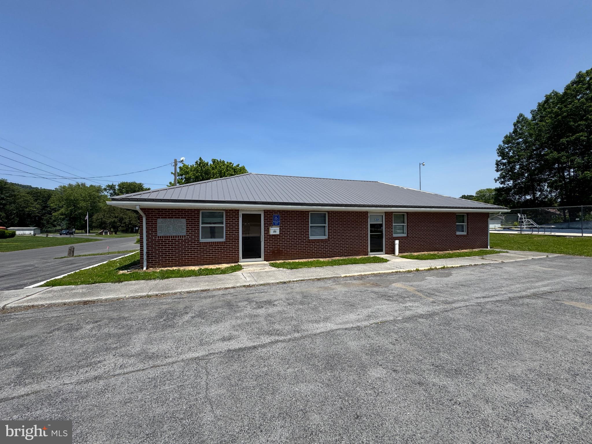 Looking for office space or a location for a business?   Tanning beds, beautician, barber,  day care?  The opportunities are endless.  The square footage is just the large  room but also includes a bathroom and kitchen area.  If this isn't enough space for your needs, consider the whole building.  Each section has its own entrance and plenty of parking.  Owner is willing to do some modification.