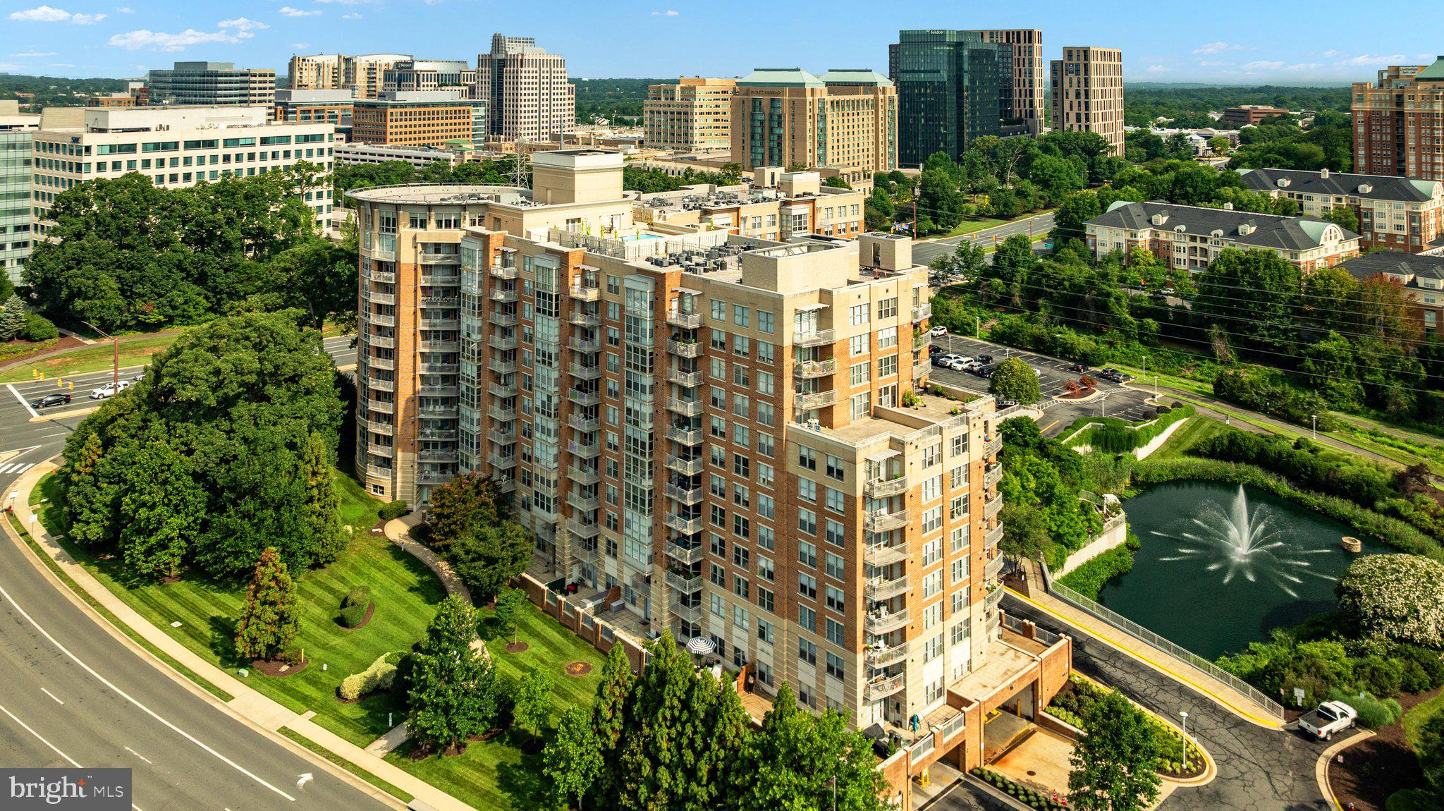 Treetop Views to South and West from oversize BALCONY | TWO Bedrooms | THREE Walk-In Closets + Coat Closet | TWO Bathrooms | TWO Assigned Garage Parking Spaces | TWO Storage Bins. This condo unit is Original Ownership, meticulously clean, and never rented. Bedrooms separated by open Living, Dining, and Cooking area. Floor to Ceiling windows w newer Blinds. Second Bedroom with two closets, one so large it was used as an Office! Second Full Bathroom with tub and shower that has rarely been used.  Furnace/AC NEW in 2025. Natural Gas water heater replaced in 2023. Clothes Washer and Dryer NEW in 2025. Updated Stainless appliances in Kitchen include Bosch Dishwasher NEW in 2025.  Pet Friendly Carlton House Condominium is adjacent to W&OD paved 55 mile trail, is just 0.3 miles to Reston Town Center Silver Line Metro and  7.7 miles to Dulles International Airport. Condo dues include Water/Sewer/Trash, Garage Parking, Storage Bins, Secure elevator building with front desk Concierge and Visitor Parking, Bike Storage. Entry floor hosts Exercise/Weight Room with Sauna, Movie Theater, Business Center,  three Gathering Spaces. Rooftop/13th floor Amenities include POOL, Outdoor Gas Grills with patio tables and social seating, Great Room with large flatscreen TV, Billiard Room, Indoor Dining Room.  Extensive Activities to include monthly happy hours, coffees, and planned social activities. Outdoor serene space includes Pond with Fountain and Benches. NO Reston Association Dues but easy access to 1,350 acres of RA open space, lakes, and over 50 miles of paved pathways. Option to purchase RA pass for Tennis and Pickleball and additional pool options. Reston Town Center (RTC) is accessible via traffic control light. RTC offers extensive dining and shopping and entertainment opportunities to include outdoor concerts, festivals, ice skating!