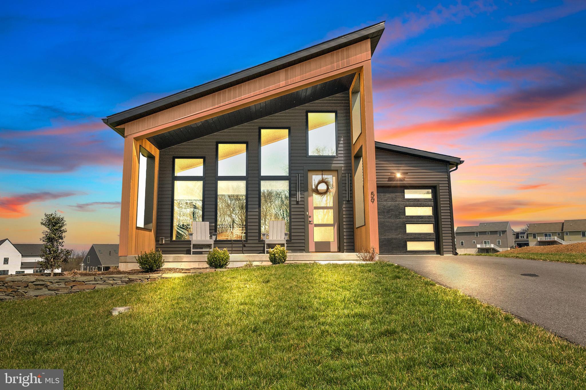 Better than new construction and less expensive! Why wait when you can settle on this home quickly and be the first to enjoy the newly finished, walk-out basement which has a full bath, recreational room, office alcove, additional flex room with privacy door and ample closets for storage needs. Main level entry welcomes you with lots of natural light due to the high windows and soaring ceiling in the open concept great room which hosts the living room, dining area and kitchen and provides expansive views of the surrounding mountain range. Barn doors off of this area lead to the spare bedroom with the owner's suite located at the rear of this level with a walk-in closet and private bath. The modern kitchen has stainless steel appliances, custom tile backsplash, walk-in pantry and plenty of counter space for any chef to create a homecooked meal.  Sleek powder room with floating cabinet and side access door with built-in blinds opens to the no-maintenance, composite deck with custom iron railing. Laundry hook-up is located in the garage area to allow for more closet space within the home. The front covered porch is complimented by the professionally designed stone walled garden with year-round perennials. Extras include luxury vinyl plank flooring on the main level, recessed lighting throughout, one-piece custom toilets, bladeless fans and Roman room darkening shades on main level for nighttime privacy. Located nearby is plenty of shopping options and access to major roadways. Don't want to cook, you have choices to enjoy a meal or craft beer at the 501 Grill & Tavern which is within walking distance to the property or hop in the car for a short ride to Do-Goods Tavern for nightly specials and a friendly crowd.  Certified 5-star energy construction and appliances throughout keep utility bills reasonable. Come tour this lovely functional home and call it your own!!  **NO HOA FEES** Listing Agent is related to the seller.