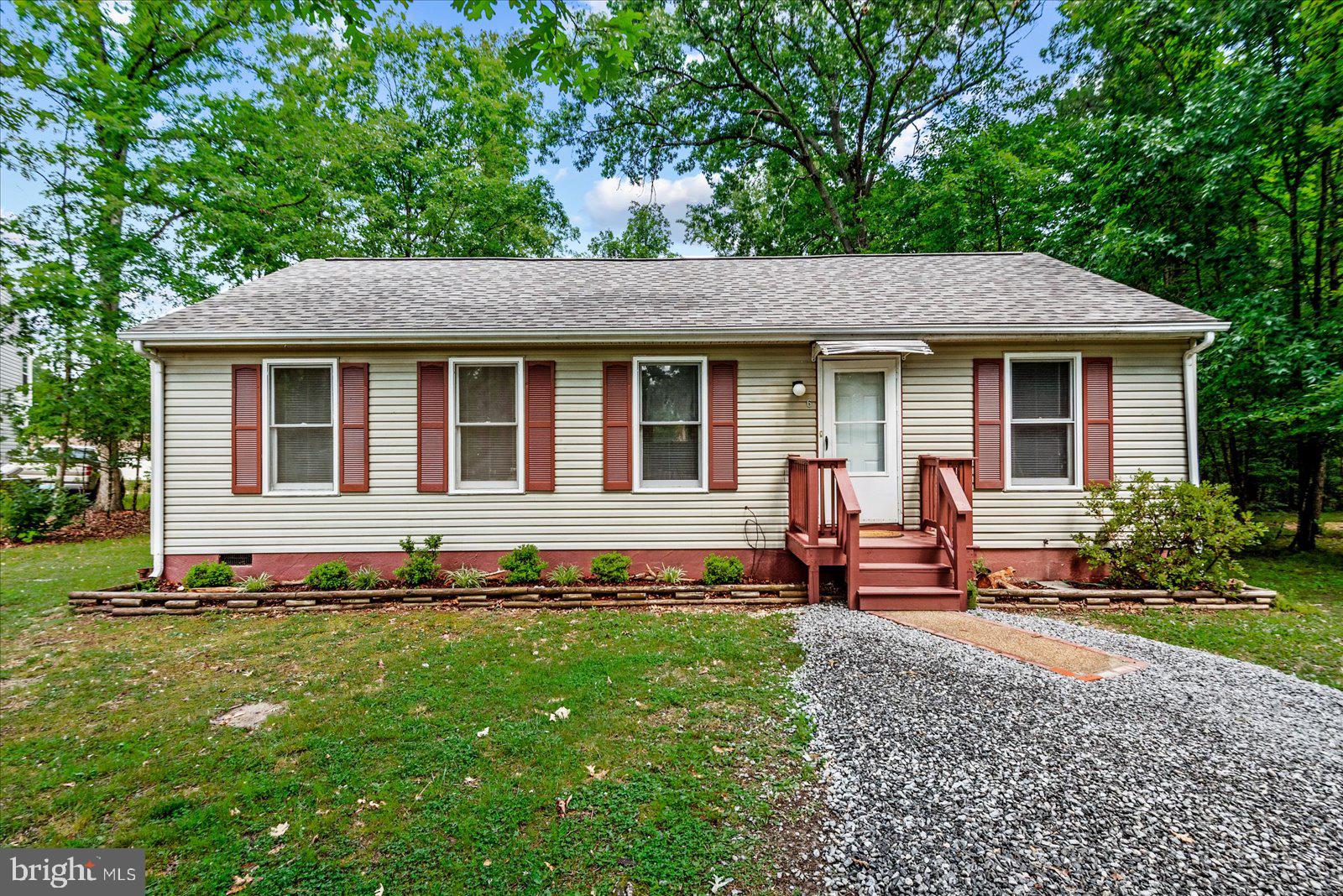 Welcome Home. This 3 bedroom, 2 full bath  home in gated Lake Caroline has been completly renovated. Freshly painted, new roof,  new flooring, new bath fixtures and new gravel in driveway. All of this and under $300,000.  Come and take a look what this home has to offer.