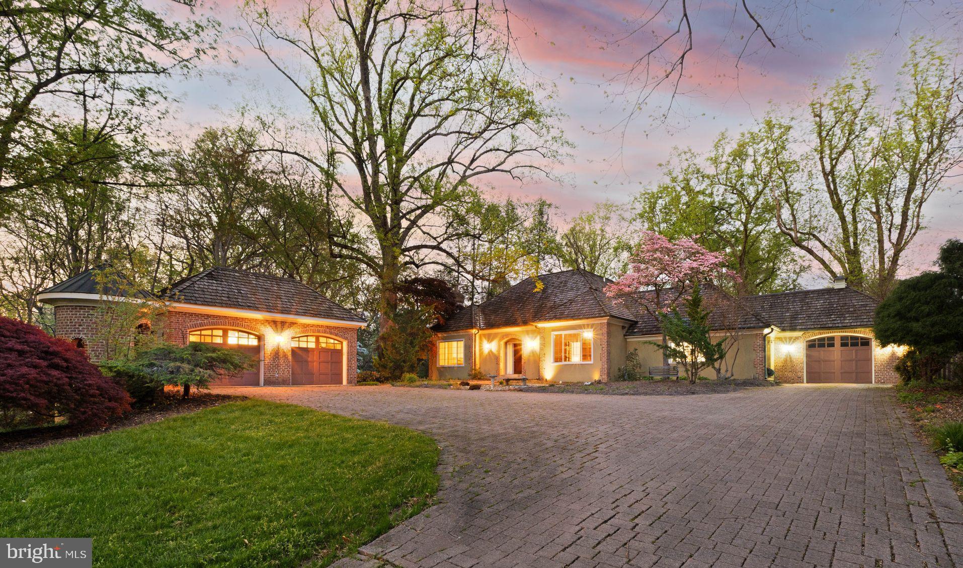 Stunning European-inspired residence on an exceptionally large lot—rare for Arlington—just 10 minutes from Georgetown, DC. Thoughtfully designed for multigenerational living, this beautifully renovated home (2022) offers both elegance and flexibility, complete with a private in-law suite and elevator access to all three levels.

The upper level features two spacious bedrooms, each with its own full bathroom. The expansive primary suite is a true retreat, boasting a generous walk-in closet with ample space for a custom multi-level shoe collection. Natural light pours into the bedroom, bathroom, and closet through abundant windows and skylights, creating a bright and inviting atmosphere throughout the day.

On the main level, you’ll find a sunlit wood-accented office, a welcoming living room with a gas fireplace, and a formal dining area. The oversized kitchen is designed for both everyday living and entertaining, featuring a remodeled island with bar seating, a farmhouse sink, and even a charming wood-burning fireplace for added warmth and character.

The fully independent in-law suite offers complete privacy with its own kitchen, washer/dryer, HVAC system, private entrance, attached garage, and direct pool access. The suite also includes a bedroom with a walk-in closet and a beautifully appointed Italian-style full bathroom—perfect for extended family or guests.

The lower level opens to the backyard oasis, complete with a heated pool. This level includes three additional bedrooms and two full bathrooms, including another potential primary suite with walk-in closet and en-suite bath.

Car enthusiasts and entertainers alike will appreciate the rare parking capacity: an attached garage plus a detached garage accommodating up to four additional vehicles, along with a cobblestone driveway that can host a crowd.

Outdoor spaces are equally impressive, with lush front lawn, multiple balconies, and serene views of the expansive property—perfect for relaxing mornings or hosting unforgettable gatherings.

Light-filled, versatile, and ideally located, this exceptional home offers luxury living with unmatched functionality.