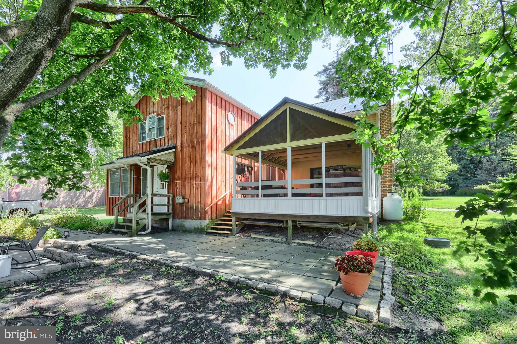 Welcome to 4.53-acre property blends historic charm with modern updates, featuring a 3-bedroom, 2.5-bath Civil War–era farmhouse. Outside, you’ll find a 16x24 shop, 18x36 greenhouse, and 12x16 shed — plus fenced gardens with raised beds (electric and water at every site) 
Step inside to hardwood floors, exposed log walls, updated appliances, newer windows and doors, a modern water system, newer roof, and 200-amp electric service. Enjoy mornings on the covered deck and evenings soaking in the quiet countryside.
All of this just minutes from Michaux State Forest, 15 minutes to historic downtown Gettysburg, and an easy commute to the Maryland line. Country living has never been so convenient!