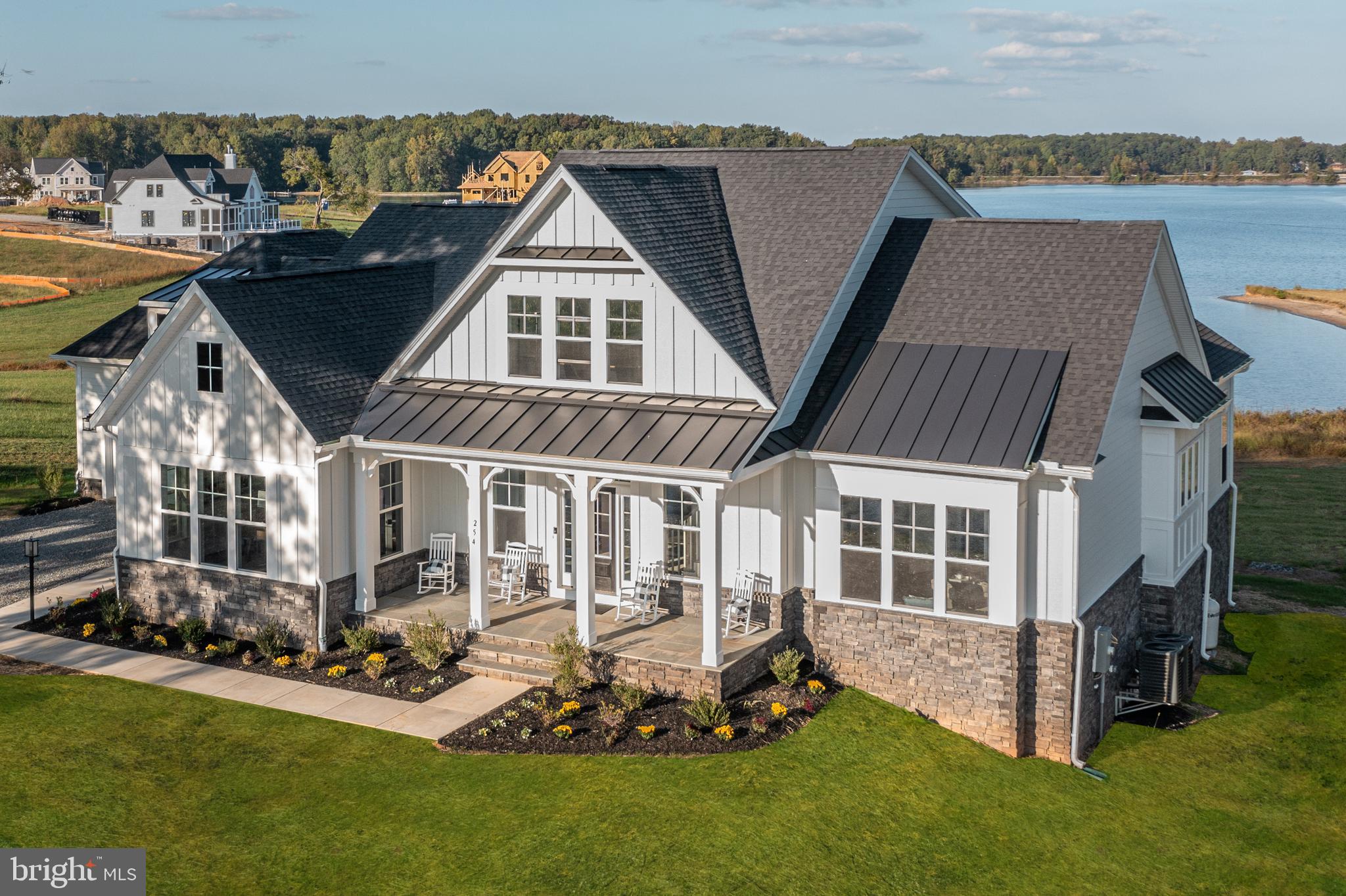 To Be Built! Spectacular Waterfront Home for Sale! 400 ft of Shoreline!

Discover unparalleled water views on your own lakefront point lot! This exquisite Robey model by Evergreene Homes is situated in the new Compass Cove neighborhood on the private side of Lake Anna. This magnificent home will offer approximately 6,000 finished sq ft on 1.134 acres, featuring 4 bedrooms and 4 1/2 bathrooms with numerous upgrades throughout, a 3-car side-load garage, and low maintenance Hardi-Plank siding.

Upon entering, you’ll be welcomed by an open floor plan with 10 ft ceilings, a coffered ceiling, and a cozy fireplace in the family room. The kitchen is equipped with upgraded stainless steel appliances, tall cabinets with partial glass fronts, and under-cabinet lighting. 

The master suite, located on the right side of the home, serves as a private wing. This spacious master bedroom opens to a screened-in porch and includes a bathroom with a tiled shower and freestanding tub, as well as an expansive closet that feels like an additional room. 

The first floor also features a study/office and a large laundry room with built-in storage and coat racks. The upper level includes a loft and 2 bedrooms, each with its own full bathroom and stunning views of the lake as well. 

The finished basement offers a vast recreation room with rough-in for a bar/kitchen area, a 4th bedroom, and another full bathroom. There is additional unfinished space for media and fitness room expansion. High-speed internet is available!  

Additionally, there is an option to build a boat dock for an additional cost on over 400 ft of deep water shoreline. 

** PHOTOS ARE OF THE SAME FLOOR PLAN (ROBEY), SELECTIONS MAY BE DIFFERENT. 

10-year warranty included with the purchase of the home.