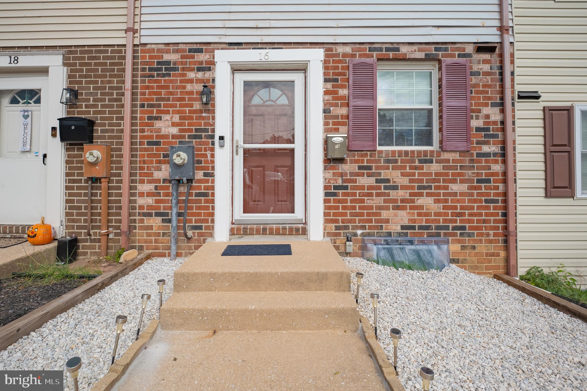 Welcome to 16 Garrison Ridge Court—a beautifully renovated, move-in-ready townhouse offering 2 bedrooms, 2 full baths, 1 half bath, and 1,536 square feet of stylish living space.

Featuring approximately $100,000 in quality renovations and upgrades, this exceptional home has been thoughtfully updated from top to bottom. The main level showcases beautiful hardwood floors, recessed lighting, and a bright, custom-designed kitchen with brand-new custom cabinetry, granite countertops, stainless steel appliances, a contemporary tile backsplash, and modern finishes throughout.

The finished lower level provides flexible living space ideal for a family room, recreation area, or home office, with a new sliding glass door leading to a private patio—perfect for relaxing or entertaining.

Recent improvements include fresh paint throughout, ceramic tile flooring in the lower level and all bathrooms, new bathtubs, new sinks and faucets, new bathroom backsplashes, new toilets, updated lighting and electrical fixtures, new interior doors with custom bedroom doors, new door hardware, a custom security entry door, new windows throughout, a new storm door, and recently replaced roof, water heater, and HVAC system for added peace of mind.

The property also includes assigned parking with additional guest parking available. Conveniently located near shopping, dining, parks, and major commuter routes, this home offers the perfect combination of modern style, quality craftsmanship, and everyday convenience.

Excluded from the sale: Security cameras, blinds, curtains, window shades, toaster oven, and microwave.