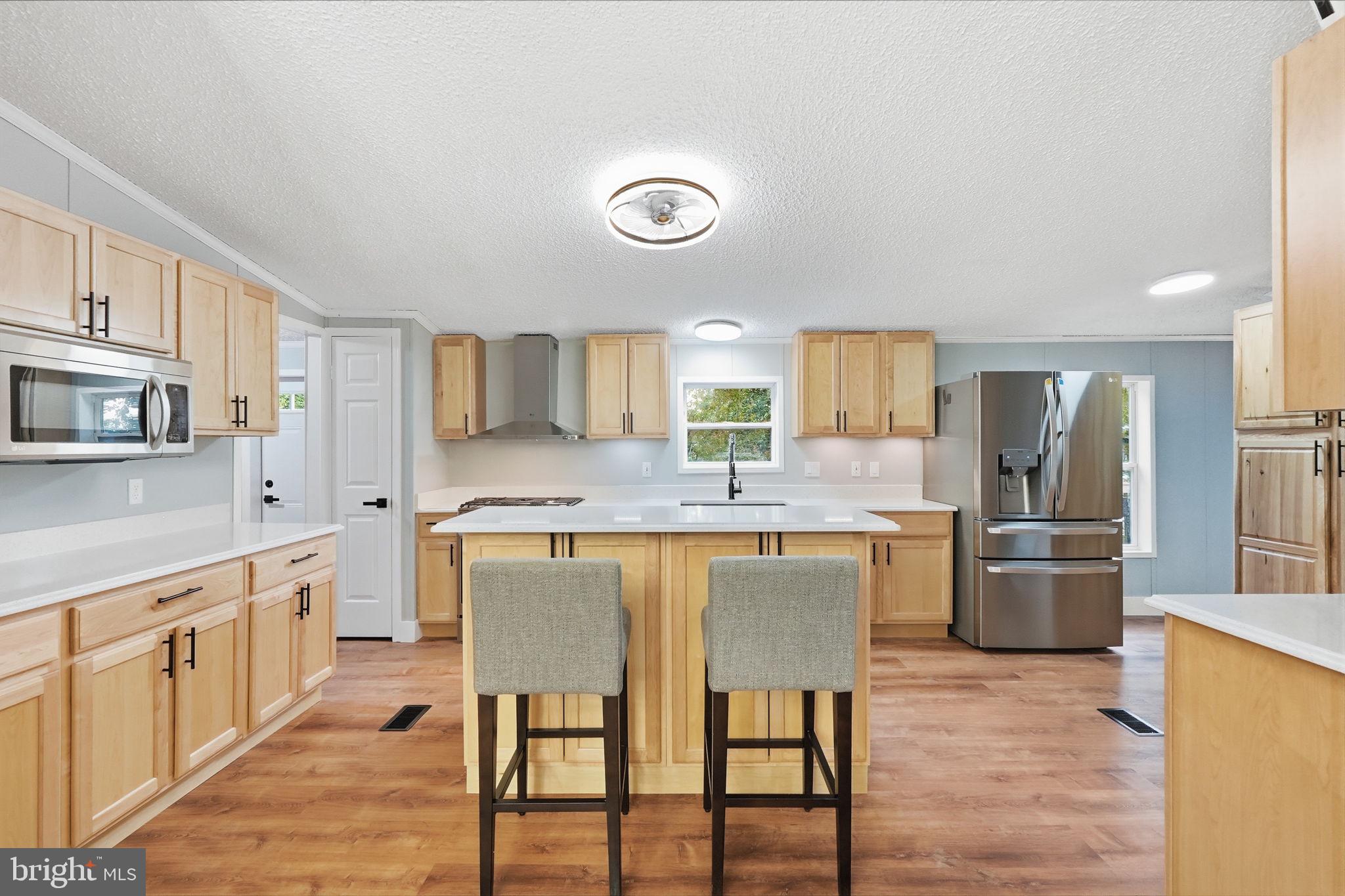 NOTE: Buyer must be approved for Community Land Lease. - Welcome Home to this Beautifully updated and move-in ready, this spacious home offers the perfect blend of comfort, style, with unbelievable kitchen and functionality. Featuring two large decks on both sides of the home, you’ll have plenty of outdoor space to relax, entertain, or enjoy peaceful mornings and evenings. The property also includes a spacious storage shed and a charming gazebo area, creating an inviting backyard setup that truly stands out.

Inside, you’ll find an open and airy layout with two fireplaces and multiple living spaces, giving the home a warm and welcoming feel while offering flexibility for entertaining, relaxing, or creating a separate family room and sitting area. The updated kitchen is a true centerpiece with a large island, abundant cabinet space, newer upgraded appliances, and a modern design that flows beautifully into the dining area.

The oversized pantry/laundry area offers exceptional storage and utility space beyond just the washer and dryer setup, making everyday living even more convenient. With stylish updates throughout, generous room sizes, and a layout designed for both comfort and functionality, this home is truly one of a kind.
Private driveway with two parking spaces plus exterior storage.
A rare opportunity to own a beautifully refreshed home with incredible indoor and outdoor living spaces.

Enjoy access to resort-style amenities including swimming pool, tennis court, basketball court, playground, and community park — a lifestyle upgrade not commonly found in nearby communities.

**Buyer must be approved by community for land lease**