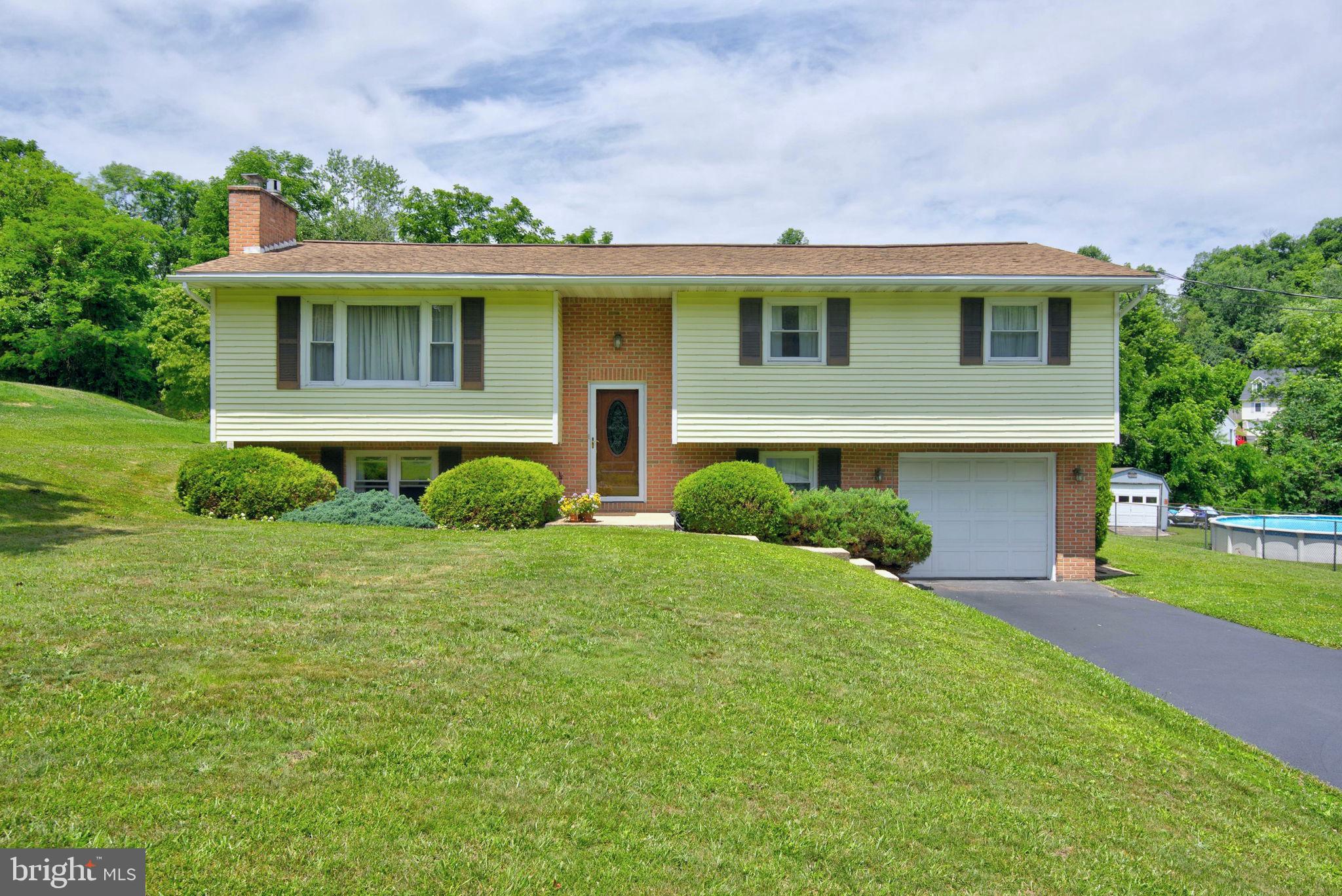 Welcome to this fantastic, move-in-ready home offering unbeatable solid construction and years of meticulous care!!!   Pride of ownership shines through every corner of this wonderful, immaculate home that is conveniently situated in Northeastern  School District!  The custom kitchen has been updated with premium solid wood cabinetry, beautiful granite countertops and updated flooring.  You will also love to step outside onto the generous covered back deck and enjoy morning coffee or evening dining...spring, summer or fall!!!  The property backs to wooded open space and is nestled not far from the Susquehanna River.  Such a peaceful and serene setting!  Inside you will find plenty of space for gathering...perfectly blending  timeless durability and comfort featuring both a wood stove  on the first floor and a gas fireplace on the lower level. In addition,  the full baths have been tastefully renovated!  The primary bedroom even includes an attached private full bath!  Plus, the oversized attached garage is ideal for extra storage or even a workshop.  This location is perfect for commuters and just minutes from I-83!  So much to appreciate with this fabulous home!!!