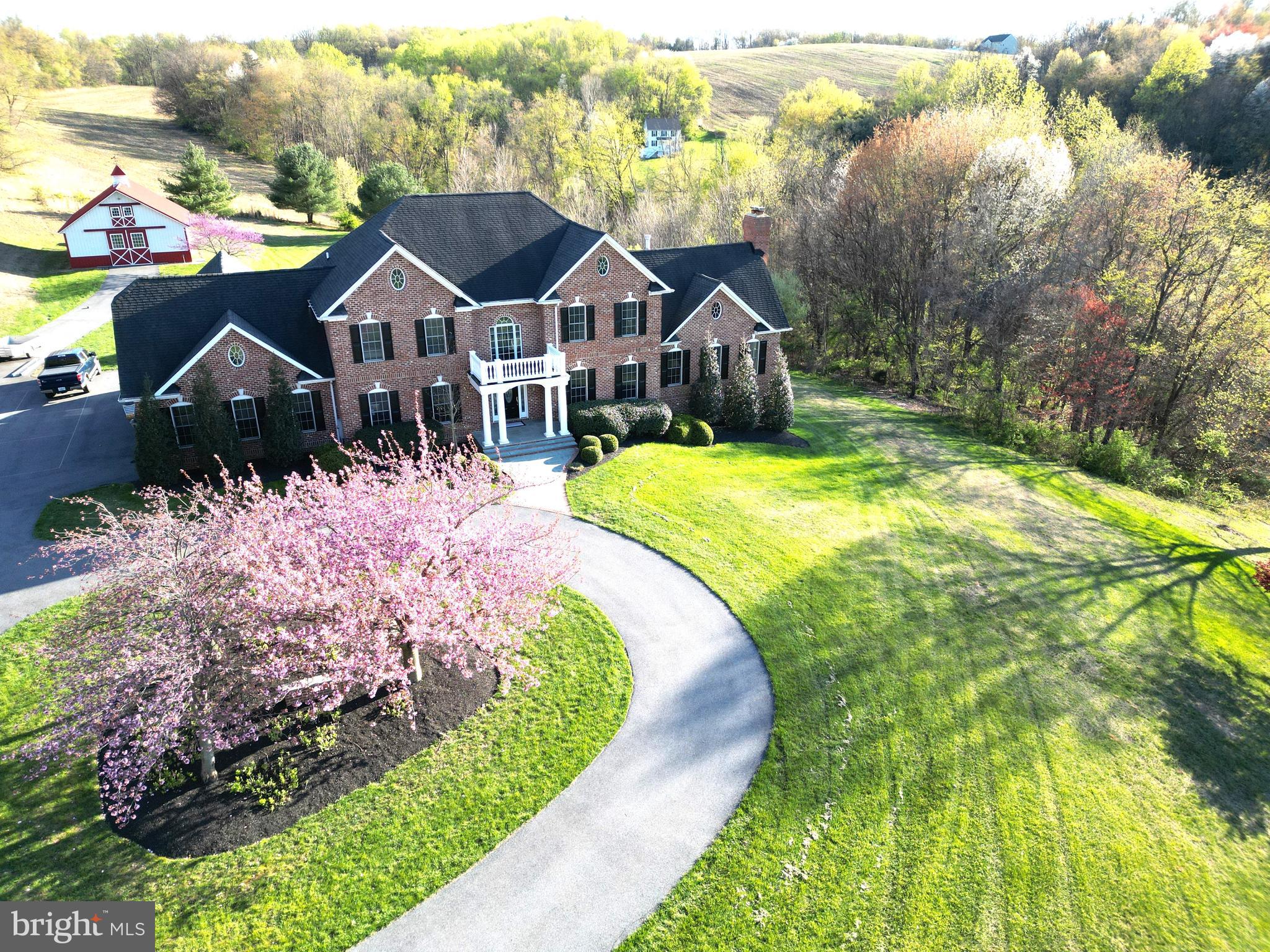 This property is amazing!! The home has Luxurious features throughout. The moment you walk through the front door the gorgeous staircase in the expansive foyer area is what first catches your eyes, flanked by a professional office and formal dining room. As you pass through you enter the large kitchen area that's complemented by rich colored cabinetry, new Silestone quartz countertops, a large island area, new 5-burner propane cooktop, all of which make food prep for large gatherings more enjoyable. This area also has a large informal eating area and is open to the sunroom and great room.  The great room offers a cathedral ceiling, floor to ceiling stone fireplace, and plenty of natural light with oversized windows...and an incredible of view of the large pond. The sunroom room area offers panoramic views of the farmed fields, woodland areas and the incredible outside recreational area highlighted by the large saltwater pool. The screened rear porch is accessed from the sunroom and quite frankly, you may never want to leave this spectacular space!! The upper (bedroom) level offers a magnificent master bedroom suite and equally impressive master bath, three large secondary bedrooms and a full in-law/guest suite with a private entrance.  The lower level is set up as a recreational space and includes a wood burning fireplace, bar area, workout/hobby room and a huge activity area.  There is plenty of storage for vehicles, equipment, or motorized toys, in the oversized attached 3-car garage or in the detached pole barn. Moving on to my favorite part of this property is the 93 acres of rolling fields/woods, AND a large (approx. 1-acre) fully stocked pond. This offers outdoor recreation opportunities that is an outdoorsman's dream place! Last, but not least, the homestead has been converted into a 3-unit invest property that will provide additional income along with the 50-acres of tillable ground that's being leased to a farmer. The combined projected gross rent is $41,000 annually.  The lease agreements on the 3-unit farmhouse are month to month. This property is a permanent protected paradise subject to a Rural Legacy Easement. Please check out the pictures and virtual tour of this incredible property!