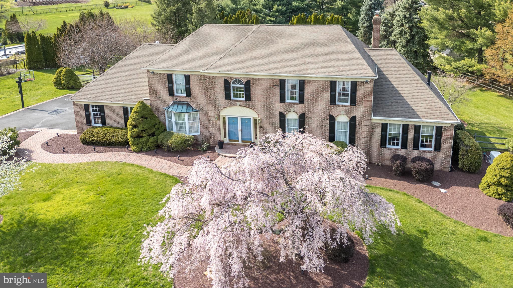 Elegant Home in Highspire – 33 Bryan Drive, Richboro

Located in the sought-after Highspire Development of Northampton Township, 33 Bryan Drive offers a spacious and well-appointed residence on a premium 1+ acre lot. This 3,928 sq. ft. home, with an additional 1,964 sq. ft. finished basement, combines quality craftsmanship and modern conveniences in a desirable neighborhood.

A brick-lined driveway and walkway lead to the double-door entrance. Inside, the 2 story grand foyer features a chandelier, wainscoting, marble like flooring and a curved staircase with solid wood steps and a rug runner. The first floor is finished with solid cherry wood flooring, adding warmth and durability.

To your right you will find the formal living room with chair rail that shares a double-sided fireplace with a library/home office or additional bedroom, complete with built-in bookshelves and glass French doors. 

Across the foyer is the large and open dining room that has enough room to fit a banquet size table with solid wood floors, wainscoting, plenty of light via a bay window and direct entrance to the beautifully finished kitchen.     

The kitchen is designed for both function and style, featuring solid cherry cabinetry, integrated Sub Zero refrigerator, granite countertops, large island and a wall of storage cabinets. A spacious eat in breakfast area provides ample seating and natural light enhanced by the bay window. Directly next to the kitchen is the family room that includes a wood-burning brick fireplace, chair rail and built-in bar, creating an ideal space for entertaining. Access to the backyard and deck is provided by a huge triple panel French door.   Adjacent is a sunroom with vaulted ceiling, a wall of full length windows showcasing nature views and easy entrance to the office.


Upstairs, the primary suite includes a fireplace, private sitting room, and attached laundry room which gives access to a huge walk in attic storage area. The primary bath offers a tiled walk in shower and a garden tub. Three additional spacious bedrooms provide comfortable living space, one with an ensuite half bath, while a full hall bath serves the remaining rooms.

The backyard is designed for outdoor enjoyment, featuring an expansive deck, inground pool, jacuzzi, plush landscaping and gazebo, all enclosed by a white vinyl and post and rail fence so your children and pets can play with ease .

The finished basement includes a game room, entertainment area, pool table room, built-in bar, and ample storage. Additional features include a three-car garage, three-zone heating and a backup generator.

This meticulously well-maintained  home in the Highspire Development offers space, comfort, and convenience in a prime location.

Schedule a private tour today.