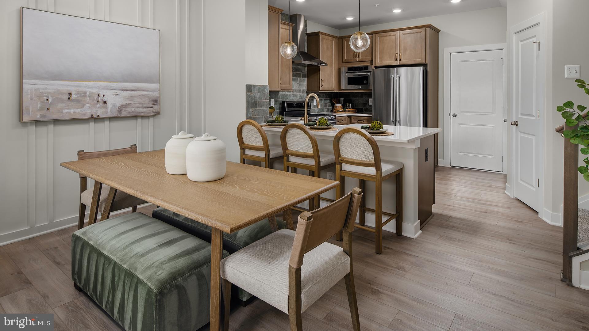 **OFFERING UP TO $25K IN CLOSING COST ASSISTANCE WITH USE OF APPROVED LENDER AND TITLE.**
New Construction, luxury 2-level condo located in the Kincora community in Dulles, Virginia. The Rosslyn floorplan is a perfect blend of style and functionality for modern living. The first floor showcases a spacious gathering room that seamlessly connects to the rest of main level. Enjoy a well-appointed kitchen that features a peninsula island, white cabinetry, quartz countertops and stainless-steel GE appliances. Additionally, enjoy luxury vinyl plank flooring throughout the kitchen, a walk-in pantry, a convenient powder room, and a 1-car garage. Upstairs, the primary suite offers a private bathroom and two walk-in closets, providing a luxurious retreat. Two additional bedrooms, a hall bathroom, and a laundry room complete the second floor, offering comfort and convenience for the whole household. Experience the best of modern living with the Rosslyn home design! Don’t miss your chance to own a low-maintenance home in Kincora, an interactive community in Loudoun County. Kincora boasts 165 acres of preserved land, walking trails, retail, office space, and convenient access to Route 7 and Route 28. *Photos may not be of actual home. Photos may be of similar home/floorplan if home is under construction or if this is a base price listing
