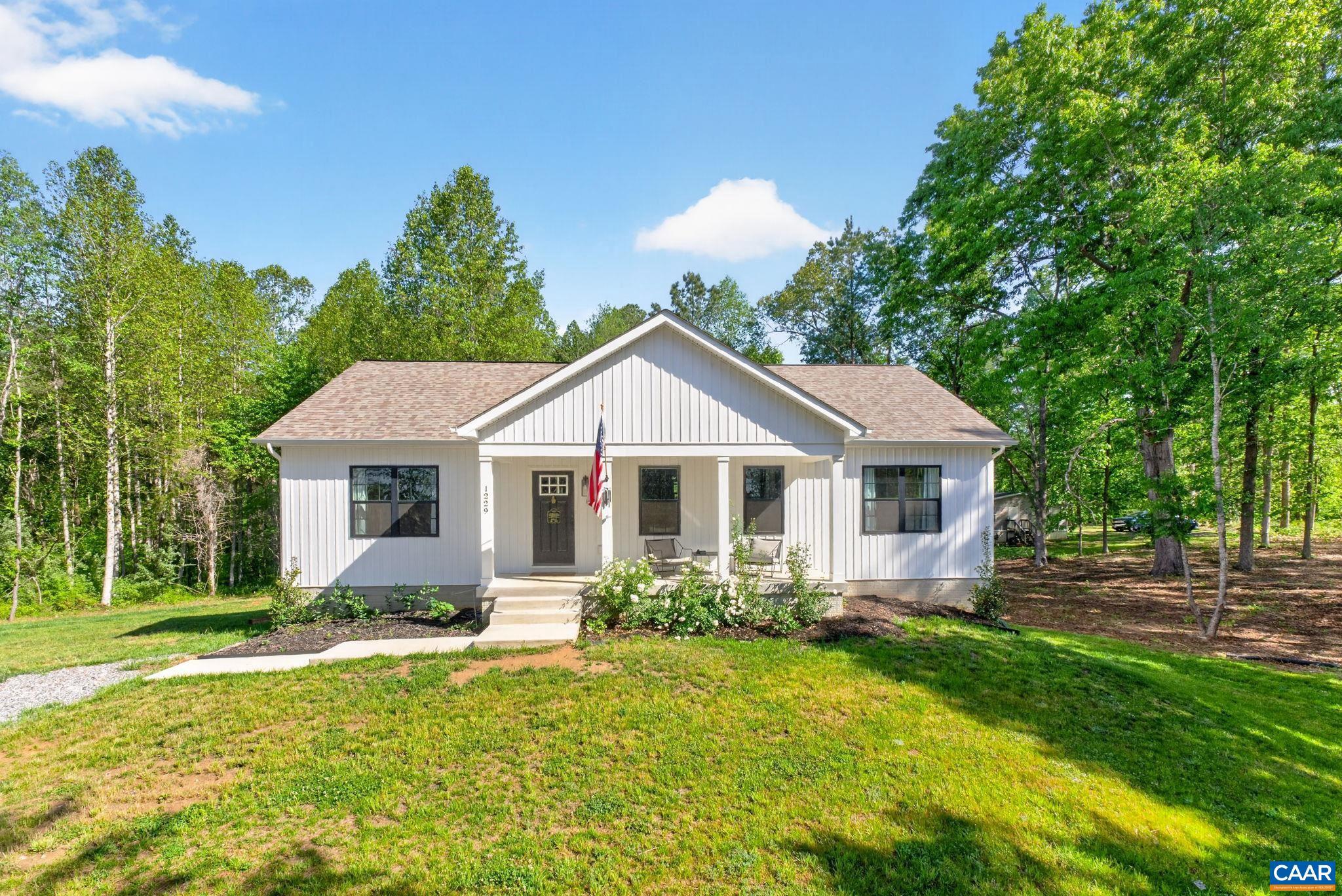 NEW PRICE! A MUST SEE! This nearly new 5 bed, 3 full bath ranch with fiber internet, an open floor plan and a full walk-out basement is privately situated on 1.5 acres! Beautiful, modern farmhouse Kitchen featuring white cabinets, large white sink, stainless steel appliances and granite counters. Rest easy in the first floor Primary Suite, featuring a walk-in closet and an ensuite bathroom with gorgeous walk-in, glass and tiled shower, standalone soaking tub and double vanity sink. Two additional bedrooms, laundry closet and a full bath complete the main level. The lower level features two bedrooms, a huge living room to spread out and a large utility room for additional storage! Establish a garden in the sunny and expansive level yard where 40+ trees have been removed and cleared. Located just 2 minutes down the road from Lake Anna with private access to parking and a boat ramp! HOA dues pay for access to the common area - boat ramp, docks and slips, playground, and pavilion.,Granite Counter,White Cabinets