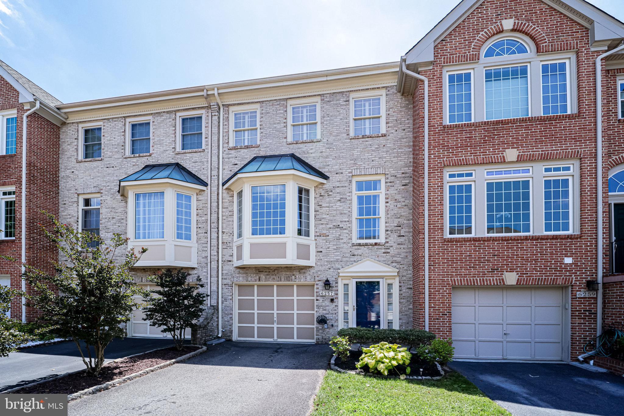 HOT LOCATION  Light & Bright Alexandria Townhome Twin Primary Suites Kingstowne/Franconia! This spacious and sun-drenched home has soaring ceilings, hardwood floors, exquisite outdoor space, and upgrades throughout.  Upon entering, you'll find a grand foyer ushering you to the main living level with hardwood floors, modern fixtures, and huge windows illuminating the expansive living/dining area.  The adjacent kitchen offers everything a host can dream of: six piece stainless steel appliance set with double wall oven and beverage fridge, kitchen table space, and loads of prep area on granite counter tops.  Your guests will love the massive deck with green views and privacy screens just off of the kitchen.  The upper level has two premier primary bedrooms with vaulted ceilings, tons of closest space, and en-suite baths with auxiliary vanities.  The front primary bedroom boasts wood privacy shutters and a modern luxurious bath with soaking tub and stall shower.  Back to the entry level; the den (and potential guest suite) has a wet bar, gas fire place with stacked stone surround, modern luxury vinyl flooring, and a sliding glass door to the patio.  The fully paved and privacy fenced in patio has access to green space just beyond the fence.  To top if off, the home has a central vacuum, a large one car garage with storage, and plenty of parking for your guests or additional vehicles.  GREAT Location between Kingstowne and Springfield Town Center; awesome schools, 1.5 miles to Franconia Metro Kiss&Ride, and just over a mile to either shopping, dining, entertainment destination.  Easy access for commuters to DC, Arlington, Tyson's, or Fort Belvior  FAST trip to 495, 395, and 95.