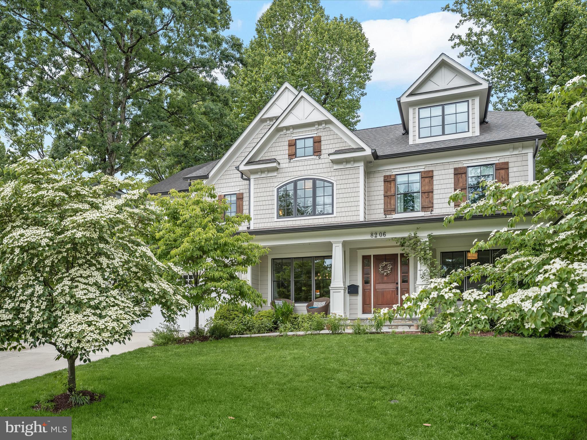 Welcome to this impeccably maintained 2015 Craftsman home, thoughtfully built by renowned Castlewood Builders. Spanning over 7,000 square feet across four spacious levels, this residence is designed for luxurious living and effortless entertaining, showcasing timeless finishes and custom upgrades throughout. Ideally located in idyllic Woodhaven, on a quiet, tree-lined street in the highly coveted Whitman School District, no detail has been overlooked in this elegant and sophisticated home.

Step into the grand foyer and take in the gleaming hardwood floors that flow seamlessly throughout much of the home. Flanking the entry, sun-drenched formal living and dining rooms feature oversized windows and tray ceilings, offering the perfect spaces for entertaining. A custom bar and Butler’s pantry provide convenient access to the stunning gourmet eat-in kitchen, complete with a large center island, crisp white cabinetry, high-end super white granite countertops, a 6-burner Wolf gas stove, dual ovens, a Sub-Zero refrigerator, and a spacious walk-in pantry. The kitchen opens to an inviting family room adorned with coffered ceilings, a gas fireplace flanked by built-ins, and multiple sets of French doors. One of the home’s standout features is the peaceful covered porch just off the kitchen, which flows to a flagstone patio and beautifully landscaped, fenced yard. This tranquil outdoor space is perfect for enjoying a morning coffee, evening cocktail, or entertaining guests throughout the seasons. A dedicated home office, a spacious mudroom with built-ins, and a stylish powder room complete the versatile and beautifully designed main level.

Upstairs, the expansive primary suite offers a serene retreat, featuring a graceful double-door entry and walls of windows framing views of the lush greenery outside. Two generous walk-in closets with custom built-ins provide exceptional storage. The luxurious en-suite bathroom boasts a jetted tub, an oversized walk-in shower, dual vanities with built-ins, and a private water closet. Three additional bedrooms on this level include two with private en-suite baths and walk-in closets, while the third shares a large Jack-and-Jill bath with a sunlit secondary office or bonus space. A convenient second-floor laundry room with built-in cabinetry and countertops adds ease to everyday living. The fully finished fourth level is an added bonus and includes a fifth bedroom with an en-suite bath and a flexible and very spacious loft space- perfect for a guest or in-law suite.

Downstairs, the expansive lower level offers even more living space with luxury vinyl plank flooring and natural light. Enjoy a large recreation room with a cozy gas fireplace, a wet bar with beverage fridge, a sixth bedroom with en-suite bath, and two additional bonus rooms ideal for a home gym, media room, or craft space. A finished storage room provides ample opportunity for excellent organization solutions. 

This exceptional home offers a rare opportunity for refined living with high-end construction and a prime location just minutes from downtown Bethesda, close to top-rated public and private schools, and easily accessible to major commuter routes. All within walking distance to Burning Tree Elementary, Pyle Middle, and Whitman High School, don't miss your chance to make this extraordinary home your own! CLICK ON THE VIDEO ICON TO SEE THE 3-D MATTERPORT TOUR & MORE!