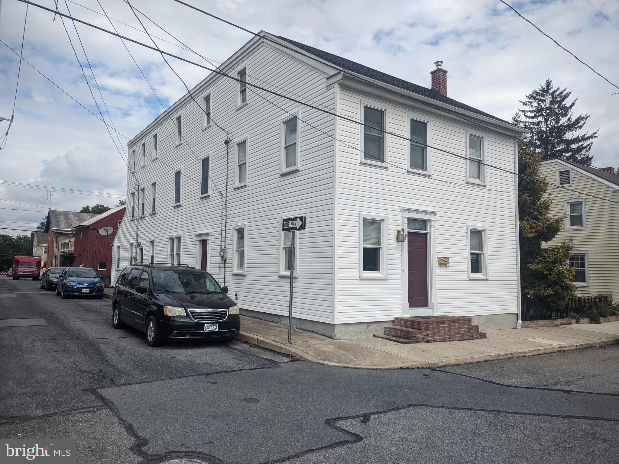 A GREAT OPPORTUNITY FOR AN ATTACHED RENTAL OR APARTMENT FOR FAMILY. The apartment has a lr, eat- in Kitche, laundry and full bath first floor plus 2 rooms second floor. Separate heat, electric, trash but owner pays water and sewer. 
The main house has 3 bedrooms and 1.5 baths. Large gracious rooms with high ceilings and lots of bright and replaced windows make the space warm and inviting.  A main floor laundry is another plus. Gas heat and central air for year round comfort. Updated electric and a beautiful custom kitchen and built ins . The large level yard is fenced and ready to enjoy from covered porches main level and second floor. Walk up attics will provide for ample storage too.