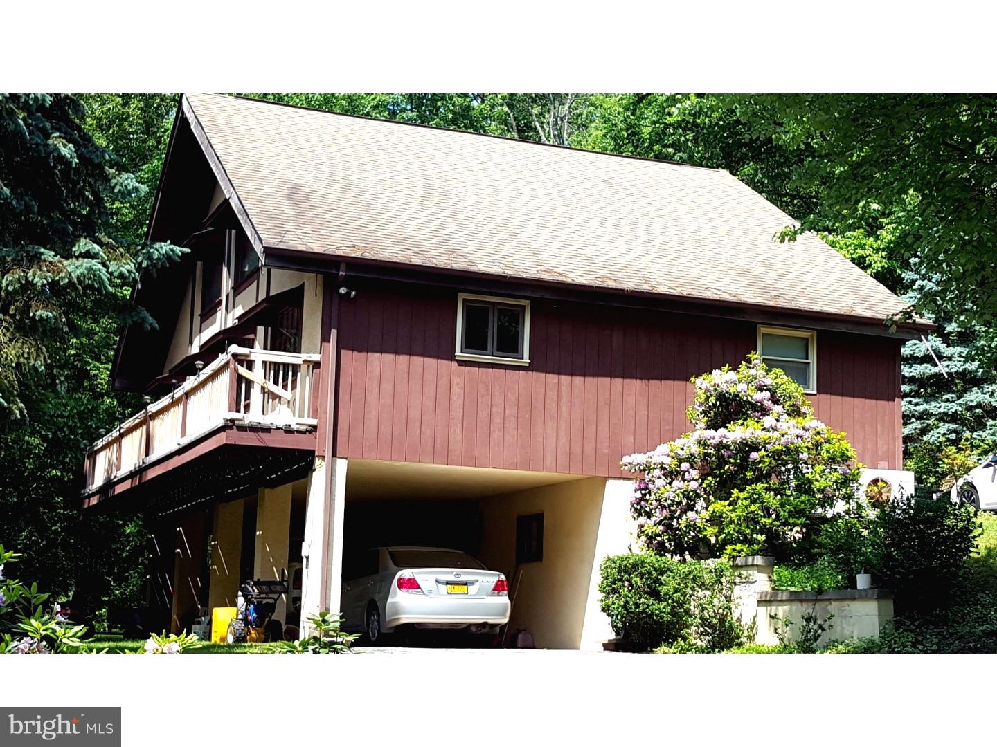 Welcome to nature! This spacious A Frame is located on 3 wooded acres in the Oley School District. The cathedral ceilings brings in tons of natural light and allows for a secluded master suite located in the loft. A second bedroom is on the main level and also has a private bath. Finish the lower level for additional bedrooms or a family room! It has a private entry from the covered carport. The eat-in kitchen has plenty of cabinets and all appliances remain! Charm abounds throughout this home, from the detailed moldings, to the rustic re-purposed posts and beams. There is no lack of character here!A wrap-around porch adorns the front of the home, and the private woods are in the rear, along with a shed. Bring your creative touches to make this one of a kind home your own!