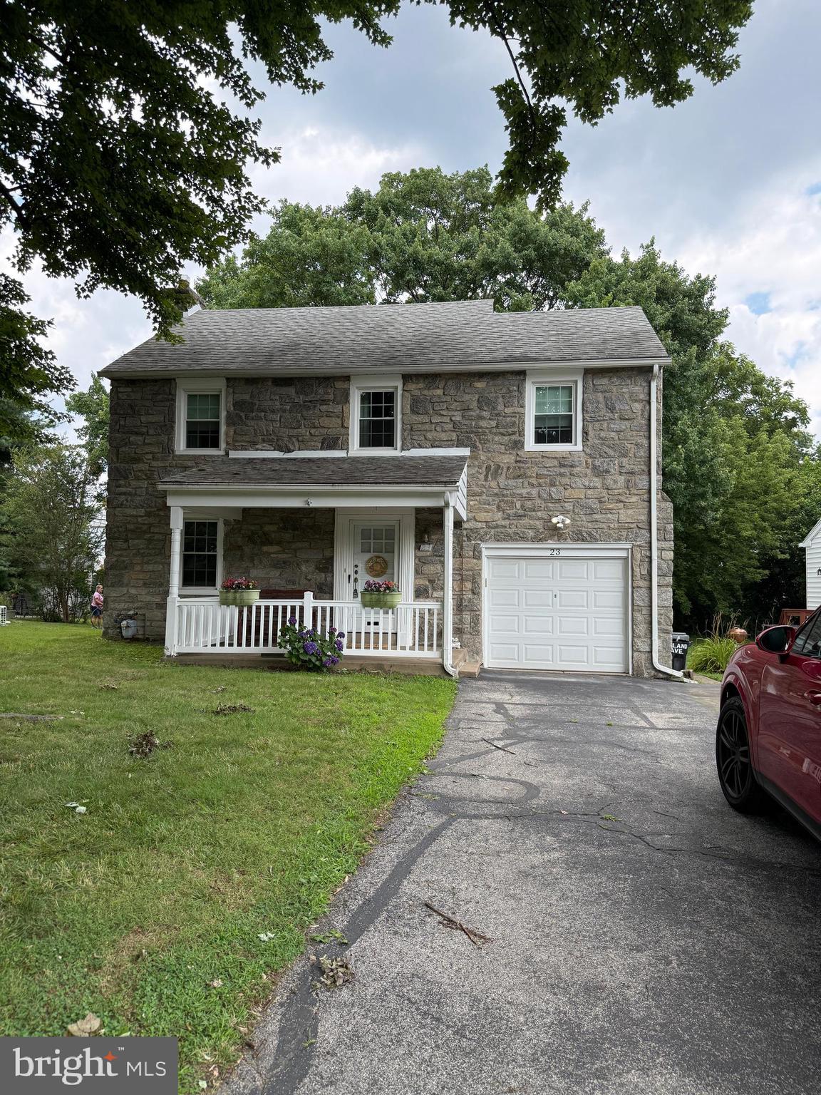 This little gem is exploding with good memories and a history of just ONE family since it was built in 1945!!!  Charming 1945 Stone Colonial is available for the first time since 1945, this cherished, single-family-owned stone colonial is available. Brimming with warmth and character ,down to the crystal door knobsthis 3-bedroom home offers a solid foundation with some major mechanical updates already completed and also some interior cosmetic upgrades may be desired. Enjoy peace of mind with a newer AC unit (2022), replacement windows (2020), a new garage door and opener (2019), and updated gutters (2017).Inside, you will find a central vacuum system and a spacious walk-up attic equipped with a powerful whole-house fan. Excellent storage with quick access. This house was loved and cared for over the decades and is ready for new colors and modern elements.  You'll love the flat, large back yard that is shaded by the most beautiful maple tree that has been the spectator of many barbq's and get togethers over the years. Location Highlights:Schools: Directly across from Richardson Middle School and a 3-minute walk to Springfield High School.Recreation: 2-3 minute walk from Trolley stop. Just 1.5 miles from Springfield Country Club.Convenience: Located 1.4 miles from Springfield Mall, Baltimore Pike, and public transit links.