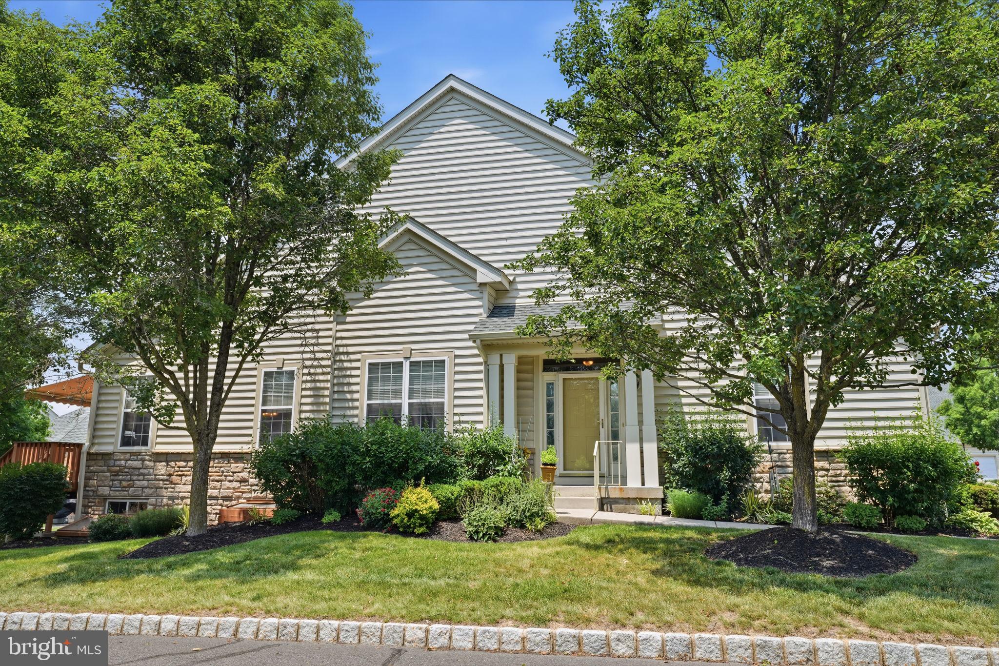 Welcome to easy, maintenance-free living in this beautifully maintained end-unit ranch offering the convenience of one-floor living and an abundance of upgraded features throughout. The attractive stone and vinyl exterior, covered front entrance, and desirable end location create exceptional curb appeal.
Step inside to find gleaming wood flooring throughout much of the main living area, recessed lighting, decorative foyer shelving, and a spacious, open-concept floor plan. The dining room showcases a dramatic cathedral ceiling, while the expanded kitchen is a chef’s delight, featuring 42" cabinetry, granite countertops, stainless steel appliances, double oven, pantry, tiled backsplash, and a large center island perfect for entertaining. Adjacent to the kitchen, the bright breakfast area offers a sliding glass door leading to an oversized composite deck complete with an electronic awning—an ideal setting for morning coffee, outdoor dining, or simply relaxing and enjoying the surroundings.
The primary suite serves as a private retreat with a spacious sitting area, walk-in closet with custom shelving, additional double closet, and a luxurious en-suite bath featuring a deep soaking tub, ceramic tile shower with built-in seat, and double granite vanity. A second bedroom and additional full bath provide comfortable accommodations for family and guests. The main level is completed by a convenient laundry room with utility sink and direct access to the two-car garage.
The finished lower level significantly expands the living space and features an egress window, large recreation area, private office with natural light and recessed lighting, half bath, and an expansive storage room. Additional highlights include HVAC replaced in 2018, composite decking, remote garage door access, and ample storage throughout.
Offering the perfect combination of comfort, functionality, and low-maintenance living, this exceptional home is ready for its next owner.
Located in desirable Bucks County, Pennsylvania, Lamplighter Village is a highly sought-after 55+ active adult community known for its beautifully maintained homes, friendly atmosphere, and convenient location. Residents enjoy a low-maintenance lifestyle with community amenities that typically include a clubhouse, fitness facilities, social activities, and walking paths that encourage an active and engaging lifestyle. The community is just minutes from shopping, dining, healthcare facilities, and major roadways, providing easy access to nearby destinations such as Doylestown, New Hope, and Philadelphia. Combining comfortable living, a strong sense of community, and the charm of Bucks County, Lamplighter Village continues to be a popular choice for active adults seeking convenience, connection, and quality of life.