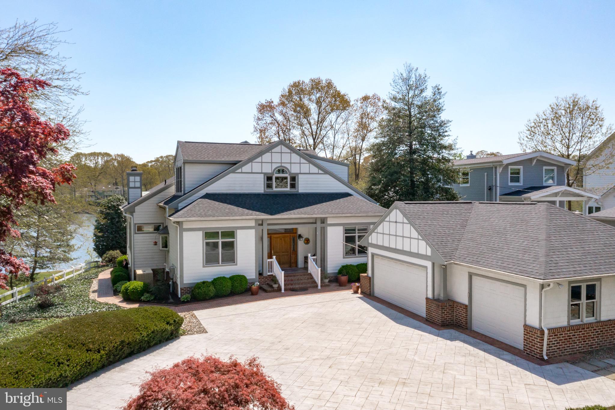 Severna Park waterfront living at its best! Welcome to 363 South Drive. A stunning home on a picturesque .94 acre lot. Deep protected water (6ft MLW), new boat lift, multiple decks overlooking the water and just seconds to the Magothy River. This craftsman style home meets modern design, just over 9ft high ceilings, open floor plan, 3 car detached garage and amazing water views. The open gourmet kitchen has granite countertops, stainless steel appliances , maple hardwood floors and new 36-inch gas range.  The Primary Bedroom is on the MAIN LEVEL and features a recently updated bathroom with his/hers closet and BIG views of the water. The waterfront living room has wood burning fireplace, extensive recessed lighting and hardwood floors. Just off the living room and Primary Bedroom is a beautiful screened in porch that overlooks the water.  The versatile upper level has an oversized bedroom that could be used as a Primary Bedroom and also has great space for an office or study area. The seller has done numerous improvements, new roof, replaced bulkhead, replaced the majority of the boards on the pier, replaced the HVAC for the upper level and added electric service to the pier. Magothy Beach has public water, sewer, Severna Park Blue Ribbon schools and is conveniently located close to Rt 2. Don't miss out on this one!