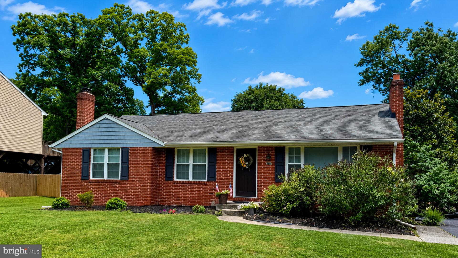 Welcome home to 8028 Woodholme Circle in Pasadena, a beautiful brick rancher tucked away on a low-traffic street in the heart of Anne Arundel County.
Inside, the open-concept living area feels bright, warm, and welcoming with large windows, hardwood flooring throughout, and a classic brick fireplace that anchors the space. The kitchen offers a great mix of style and function with granite countertops, stainless steel appliances, a custom tile backsplash, and plenty of cabinet space for everyday living.
The main level also includes a comfortable primary bedroom with two closets and a private ensuite bathroom, plus two additional bedrooms with access to a full hall bath. The unfinished basement (basement ceiling height 6 ft 5 in) adds even more flexibility, whether you need storage, a home gym, workshop, hobby area, or room for future possibilities. Out back, mature fig and cherry trees are already established and producing, adding something special to the fully fenced backyard, while the fire pit area creates the perfect spot to enjoy evenings outside.
With easy access to major highways, shopping, dining, and everyday conveniences, this Pasadena rancher offers comfort, charm, and a wonderful place to call home.