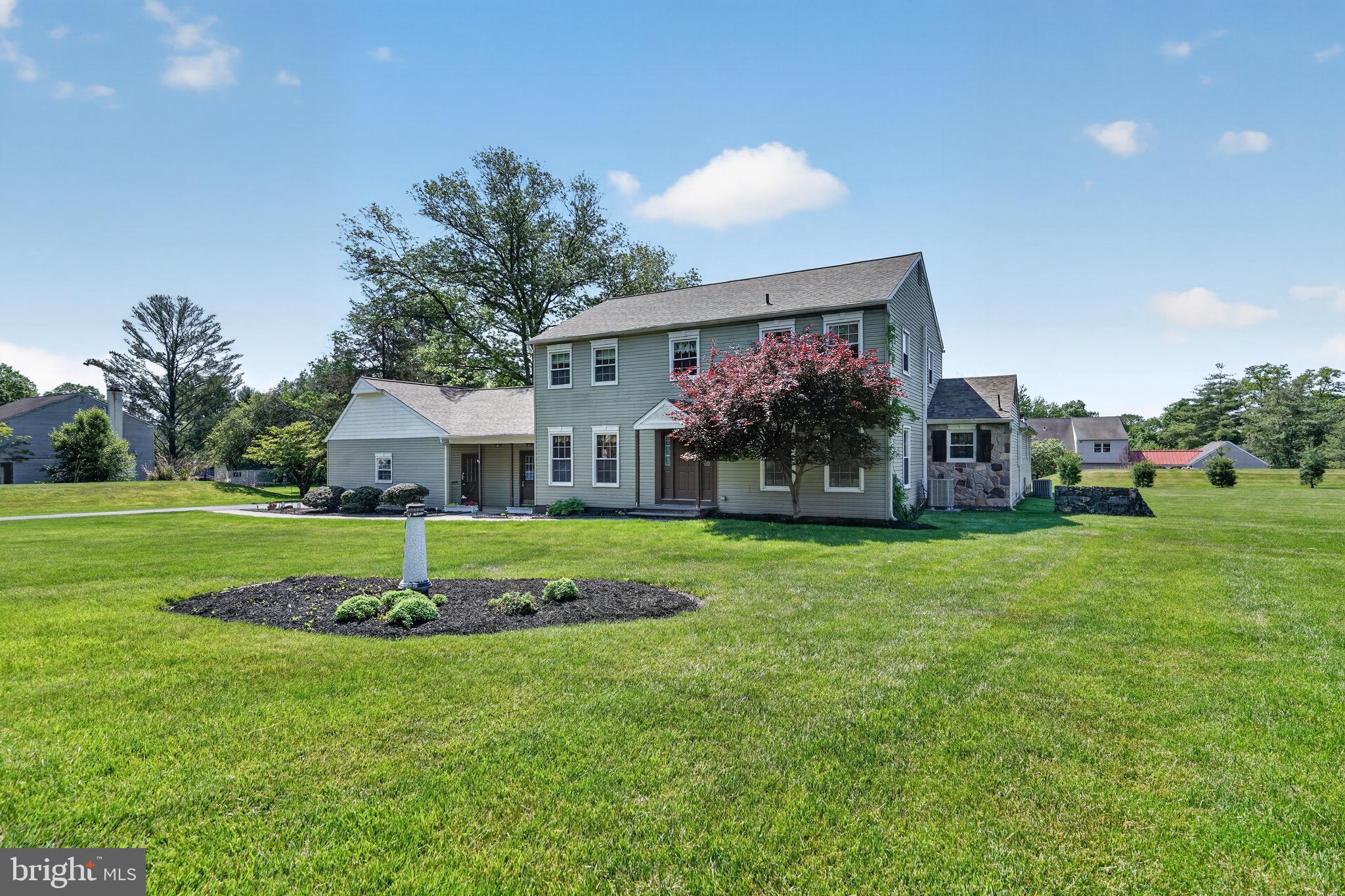 Nestled on a picturesque ¾-acre lot in the prestigious Mount Eyre Manor subdivision of highly sought-after Washington Crossing, this exceptional 6-bedroom, 3.5-bath residence offers the perfect blend of timeless character, modern upgrades, and flexible multigenerational living. Boasting 3,729 square feet of beautifully maintained living space within the acclaimed Council Rock School District, this home is surrounded by the elegance and serenity that make Upper Makefield Township one of Bucks County’s most desirable communities. Adding incredible versatility and value is the fully functional in-law suite with its own private entrance. This beautifully appointed space includes two spacious bedrooms, a full bathroom with walk-in shower, full kitchen, and brand-new carpeting throughout — ideal for multigenerational living, extended guests, au pair accommodations, or potential supplemental living arrangements. The main residence welcomes you with a large sunken living room centered around a stunning floor-to-ceiling brick hearth with a wood-burning fireplace, creating a warm and inviting focal point for gatherings. Sliding glass doors lead to a covered rear patio overlooking the expansive backyard, offering seamless indoor-outdoor living. The oversized kitchen features newer stainless steel appliances, abundant cabinetry, and generous workspace ideal for entertaining or everyday living. A formal dining room with crown molding, chair rail detailing, and fresh paint provides an elegant setting for special occasions, while the spacious living room and bedrooms all showcase refinished hardwood floors and replacement windows throughout the home. The luxurious primary suite offers a private retreat complete with an en-suite bath and walk-in closet, while the additional bedrooms are generously sized to accommodate family, guests, or home office needs. Thoughtful updates provide peace of mind, including a new roof in 2020, new driveway in 2023, new AC system in 2025, new water heater, and a premium whole-home water purification system installed in 2025 featuring reverse osmosis, carbon filtration, and UV filtration technology. Conveniently located near the historic Delaware River corridor, residents enjoy easy access to scenic canal walking and biking trails, fine dining, boutique shopping in nearby Newtown and Yardley, and the renowned Washington Crossing Historic Park with its rich Revolutionary War history, picturesque landscapes, and year-round recreation. Offering a rare combination of size, location, upgrades, and flexibility in one of Bucks County’s most coveted neighborhoods, this remarkable property delivers the lifestyle today’s buyers have been searching for.