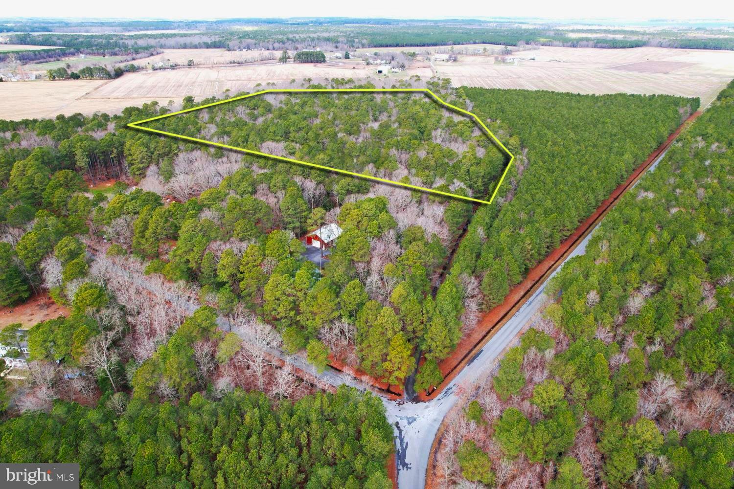 A very private setting with preparations in place for building a country home with a long driveway and views of neighboring farmland. Sellers have performed much of the heavy lifting with county septic and pond building permits. Stormwater management is in place with culverts and a gated driveway. Only a ½ mile drive to a public boat launch to Chesapeake Bay tributary waters on Fishing Creek. A 50’ English right-of-way easement was recorded by the Seller’s family several decades ago when the wooded tract was subdivided for a few adjacent homes. The property has been approved for a future BIP / Berm Infiltration Pond, and Dorchester County Health Department records can be furnished upon request. The property is zoned RESIDENTIAL and there are three septic sites that could potentially serve additional homes with buyer due diligence. Neighboring homes support in-ground or sand line trench septic. The property has a recorded exemption from Forestry Conservation with County Planning and Zoning for clearing and construction up to 20,000 sq. ft. /.46 ac.