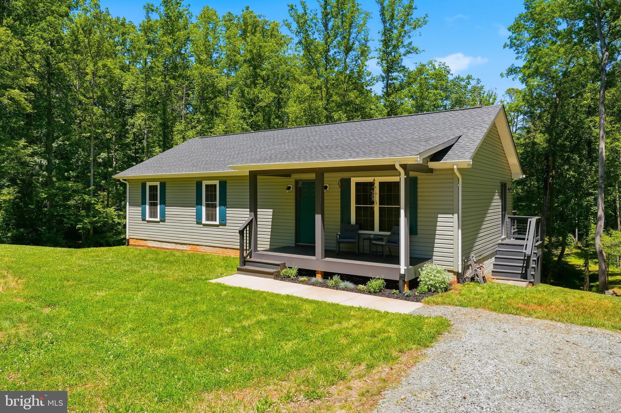 Welcome home to 898 Seville- the modern homestead starter kit for someone ready to put down roots in Madison County! Built in 2022 and lovingly maintained by its original owner, this nearly new home sits on 3 acres just off Route 29, ideally positioned between Culpeper and Charlottesville and only minutes from the Greene County line.
Step inside to discover an inviting open-concept floor plan featuring cathedral ceilings in the living room and kitchen, creating a bright and spacious gathering area that's perfect for everyday living and entertaining. Kitchen offers granite countertops, soft-close cabinetry, and ample workspace for preparing meals and making memories. 
This 3 bed/2 bath home showcases quality craftsmanship and intention throughout, including double-hung tilt windows designed for easy maintenance and energy efficiency.
Downstairs, the full unfinished basement offers endless possibilities for future expansion, hobbies, storage, or recreation. Plumbing has already been roughed in for a future bathroom, making it easy to customize the space to fit your needs. Laundry is also conveniently located in the basement, keeping the main living areas clutter-free.
Outside, enjoy the rewards of country living with established fenced raised garden beds ready for your seasonal harvest, a new rear deck perfect for starting your day or unwinding. Deck is right off the kitchen providing easy access for outdoor dining and entertaining.
This property offers the best of Madison County living. Spend weekends exploring local wineries, hiking in nearby Shenandoah National Park, visiting charming small-town shops and restaurants, or enjoying the scenic beauty that makes this region one of Virginia's most sought-after destinations. With easy access to Rt.29, you'll enjoy the perfect balance of rural tranquility and modern convenience.
Come plant your roots and experience the lifestyle you've been dreaming about.
