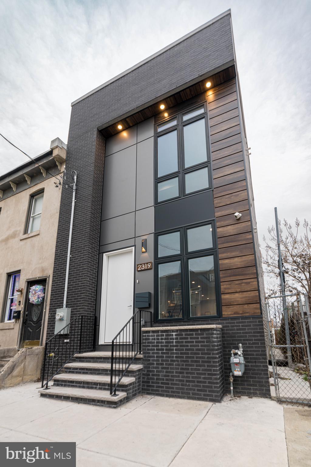 Step into a world of exquisite living at 2318 Hazzard St , where an elegant, one-of-a-kind, new construction home awaits in the hottest and most desirable area of Fishtown! This meticulously crafted sanctuary is a true masterpiece, boasting approximately 3100 sq ft of living space, 4 beds, and 4 1/2 baths. As you enter, you'll be captivated by the radiant and expansive interior, adorned with large Andersen windows , natural stunning hard wood floors, and 9-foot ceilings on every floor. The first floor unveils a custom accent walls with reclaimed accents, exquisite trim work, custom lighting, and surround sound, creating the perfect ambiance for entertaining. Journey through the first floor open floor layout, with powder room and as you walk to discover a sprawling dining area with a custom chandelier made to captivate any one, but the main focus is the double-wide dream kitchen. This culinary haven features  custom white cabinets, designer tile  with an exquisite waterfall quartz countertops, herringbow designed backsplash, and two large pantry cabinets, exuding a charm straight out of a fairytale. Living area is spacious and offers immense amount of natural lighting! Step into the rear of the home, the backyard is a private oasis, enveloped by brand new wood fencing, offering an ideal retreat for sipping morning coffee or  perfect for relaxing on a fall evening! The finished basement presents a versatile space for a media room or home gym, complete with a spacious bedroom and full bathroom, ideal for an in-law suite. Ascend to the upper levels on a custom stainless steel cable railing, to find two spacious bedrooms, hallway stacked brand new washer dryer set, and hallway full designer bathroom with the most luxurious finishes and tilework. Bedrooms have to offer immense amount of natural light and ample closet space. The master suite on the third floor is a private sanctuary, featuring a massive walk-in closet with custom built-ins, and a luxurious bedroom area and a lavish en-suite bathroom with modern soaking tub, luxurious stand in shower and elegant double vanity. Step onto the rooftop to discover a sprawling roof deck with breathtaking views of the city, completing this magical abode. 2318 Hazzard is designed to be unparalleled! This is a dream come true designed with the most luxurious and elegant features. Nestled in the vibrant Fishtown neighborhood, this home is a short stroll from an array of bars and restaurants, and public transportation and major highways, offering the perfect blend of enchantment and convenience. Don’t let this one pass you by, stop by and have your dreams come true!