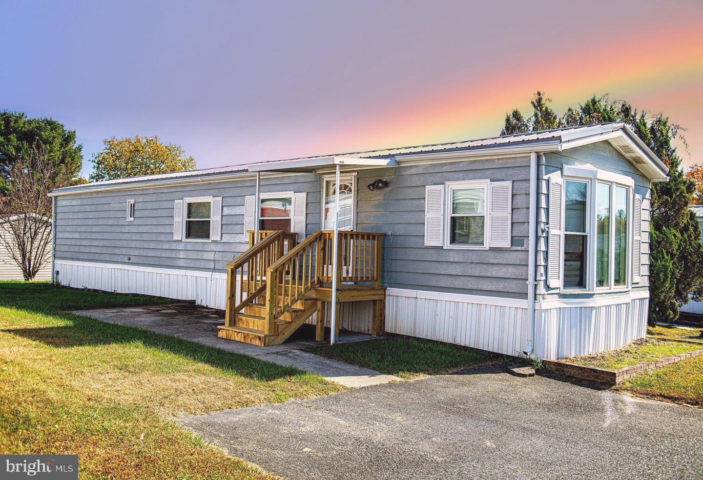 PRICE CUT!!!! WOW what a fantastic opportunity!!!!!  Welcome home to 1911 Chipper Drive, a two-bedroom, one-bath mobile home in the Harford Village Community!  Enjoy BRAND NEW carpet and paint in this comfortable and convenient one level living home with a Jack & Jill bathroom.  This home features a NEWER ROOF (within the last few years) and a BRAND NEW entry porch with a covered entrance, perfect for enjoying your morning coffee. NEWER kitchen countertop and cabinets. Located in a peaceful, well-maintained community, you'll have access to a community pool just minutes away from recreation, shopping, dining, and major highways. Enjoy outdoor recreation? Both Flying Point Park and Mariner Point Park are fifteen minutes away. This home is ideal for those seeking convenience, comfort, and a relaxed way of living. Lot rent includes: trash, recycling, snow removal, common area maintenance, and access to the community pool!! As-is.