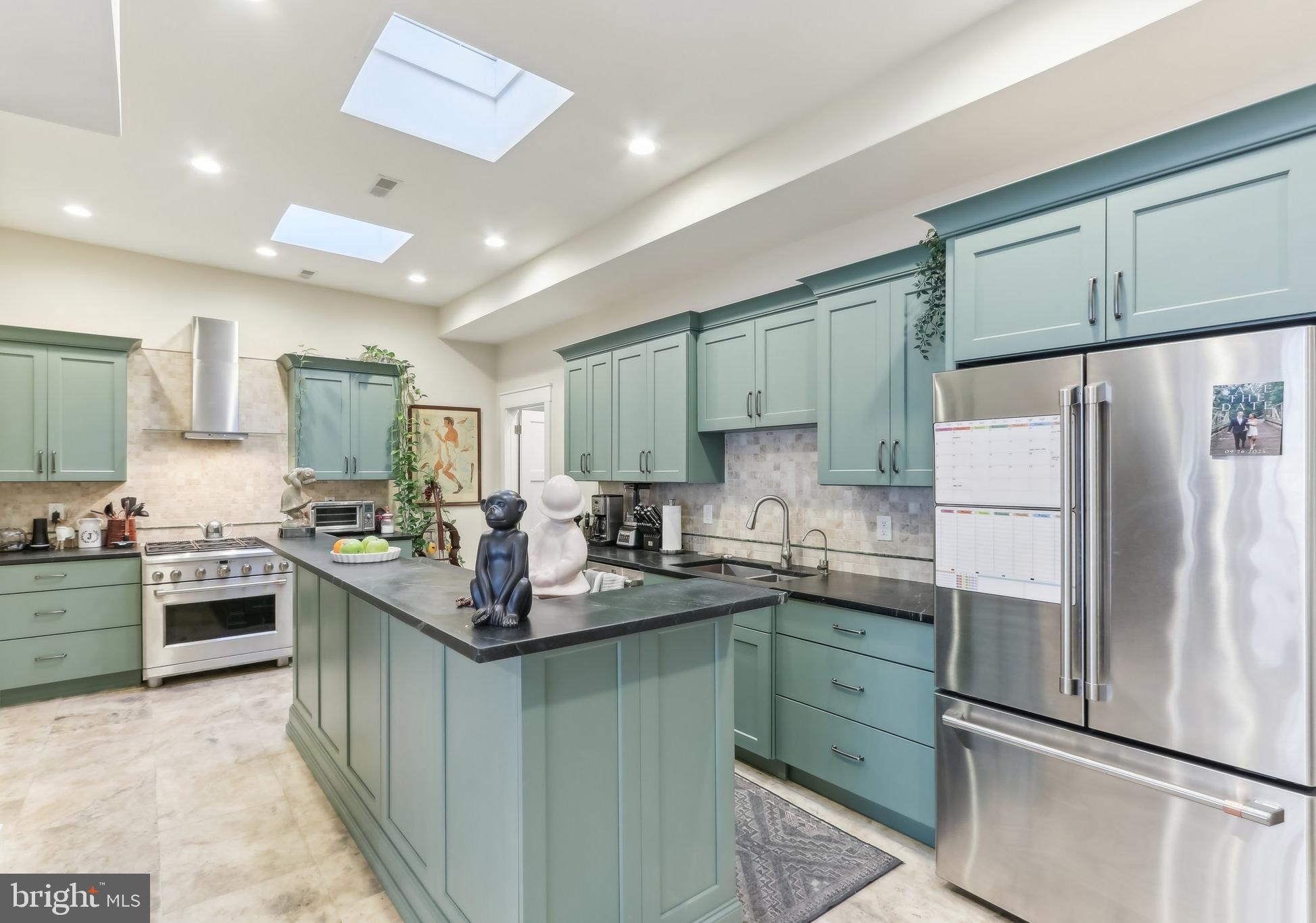 Huge double-wide home that sits on a street-to-street lot with nearly 1,000 SqFt of backyard space with gated 3-car driveway parking and endless potential for outdoor living, entertaining, or even a private garden. Renovated and expanded just a few years ago, this three-story home was thoughtfully designed. Step through the front entrance into a welcoming foyer with parquet wood flooring or enter through the rear mudroom and laundry area directly from your private driveway. At the heart of the home is the chef’s kitchen, anchored by an oversized 8-foot island and surrounded by premium finishes. Natural light pours in through skylights and expansive windows, filling the open-concept living and dining areas. A first-floor bedroom (or den) and full bathroom add flexibility to the floor plan. Upstairs, you’ll find a spacious second bedroom with double closets and an adjacent full bath, while the third floor is dedicated to the private primary suite, complete with dual closets and a sleek en-suite bathroom. The true showstopper is the backyard stretching the entire width of the property that goes from street to street. Currently designed with sandstone patio space and a crushed stone driveway, this outdoor haven is ready to be customized into your dream retreat. Located just steps from the best of Fishtown and Northern Liberties, plus convenient access to Delaware Avenue, this home offers both a vibrant lifestyle and a rare slice of outdoor space in the city. Don’t miss this one-of-a-kind opportunity! There is a Residential Rehab (Ord. 961) abatement on this property that ends 12/31/2030. Taxes and square footage is the responsibility of the buyer to have verified independently.