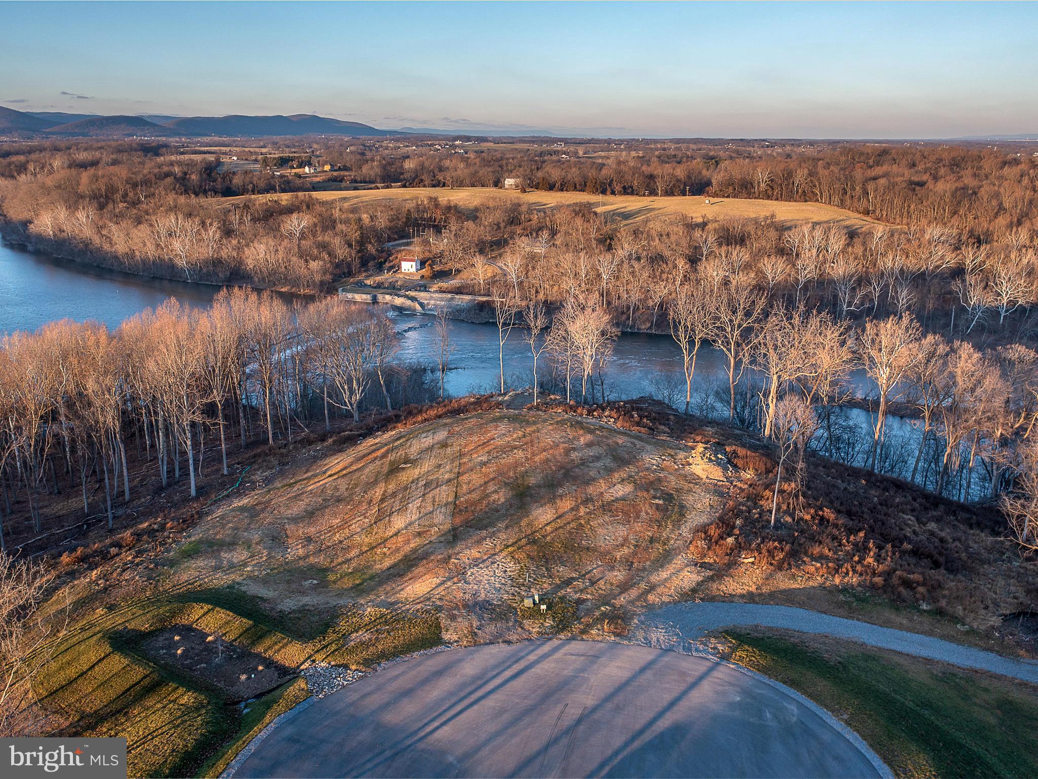 DEEP RIVER ACCESS! Majestic 6.46 acre homesite on Potomac River- Listen to the water fall at Dam 5- This  lot offers the most incredible panoramic views  of the Potomac River & Mountains -Come build your dream home! It sits at the end of a cul-de-sac in Bella Vista- a gated exclusive community consisting of only 12 homesites.  Homesite 28 offers approx 500 ft+ of direct Potomac River frontage and dominates the end of the cul-de-sac (neighboring lots will position homes far away- creating exclusive & private location for a new home.) This direct frontage exclusive frontage is after Dam 5 which boosts some of the best fishing. Lot has been graded as well as partially cleared- Still saving mature trees. Please see community C & R's.  Community does also offers 150 ft of direct community river frontage above dam 5 with Pavallion & boat ramp- Deep River for boating! This piece of Heaven is only approx 80 miles to Washington DC/ 65 miles to Dulles Airport making its location ideal! Owner is a licensed Real Estate Broker. Also listed for sale with custom new home to  be built for 2.8M- BUILD YOUR DREAM HOME- no builder tie in but Owner is a custom home builder/ Owner is listing broker