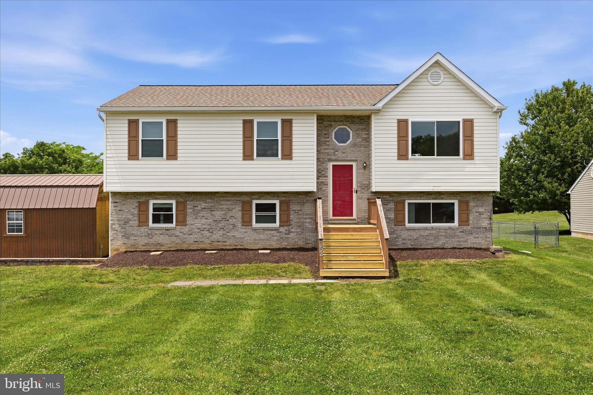 This well-maintained split foyer home offers thoughtful updates with many major improvements already completed.

The main level features a bright and open living room and an eat-in kitchen with space for gathering, creating an easy layout for everyday meals or hosting. Three spacious bedrooms, including a primary suite with a private ensuite bath, and a second full bath round out the main level. Step outside to an elevated deck and fenced backyard with room to relax, garden, entertain, or enjoy time with pets.

The lower level expands the living space with a modern and spacious rec room with built-in shelving, a fourth bedroom, full bath, and additional finished bonus rooms ideal for hobby space, a home office, gym equipment, or storage.

Big-ticket updates include an HVAC replacement in 2021, a new roof in 2017 and high-efficiency windows for added comfort and peace of mind. A combination of Pergo, LVP, and tile flooring throughout the home adds an elevated feel while keeping the spaces durable and easy to maintain.

The spacious driveway offers plenty of parking, while the detached garage is well-suited for vehicle storage or workshop use with an upgraded floor and its own breaker.

Conveniently located with access to I-81 and Route 66, local shops, restaurants, and the surrounding beauty of the Shenandoah Valley, this Strasburg home offers practical updates, flexible space, and a location that makes both daily commuting and time spent exploring the area easy to enjoy.