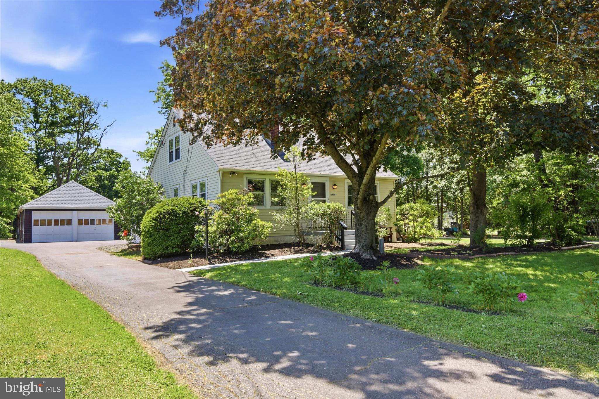 2339 E Vine St, Hatfield, PA 19440
Major recent improvements add peace of mind, including a brand-new roof, new gutters, 2 new HVAC units with zoned heating and cooling, a new hot water heater, and a new electric box. Big-ticket items: handled. Future buyer: happy dance pending.
Welcome to 2339 E Vine St, a charming Hatfield home offering space, flexibility, and a beautiful setting. This 4-bedroom, 2-bathroom single home features a practical floor plan with two bedrooms and a full bathroom on the main level, plus two additional bedrooms and another full bathroom upstairs. The main living area offers warm hardwood floors, great natural light, and a brick fireplace/wood stove feature that adds character to the space.
Major recent improvements add peace of mind, including a brand-new roof, new gutters, 2 new HVAC units with zoned heating and cooling, a new hot water heater, and a new electric box. Big-ticket items: handled. Future buyer: happy dance pending.
The kitchen has been nicely updated with gray cabinetry, modern hardware, stylish backsplash, and plenty of cabinet and counter space. Just off the kitchen and dining area, the large sunroom is a standout feature—stretching across the rear of the home with tons of windows and views of the yard, making it a perfect bonus space for relaxing, entertaining, hobbies, or additional living space.
Upstairs, you’ll find two generously sized bedrooms with closet space and a full bathroom. The home also includes an unfinished basement with laundry, offering excellent storage and potential for future use.

Outside, the property shines with a spacious yard, mature trees, a large driveway, and a detached 3-bay garage. The outdoor space offers plenty of room for gatherings, gardening, relaxing, or simply enjoying the peaceful setting. Conveniently located near shops, restaurants, parks, and major travel routes, this home combines charm, functionality, updates, and opportunity in a great Hatfield location.