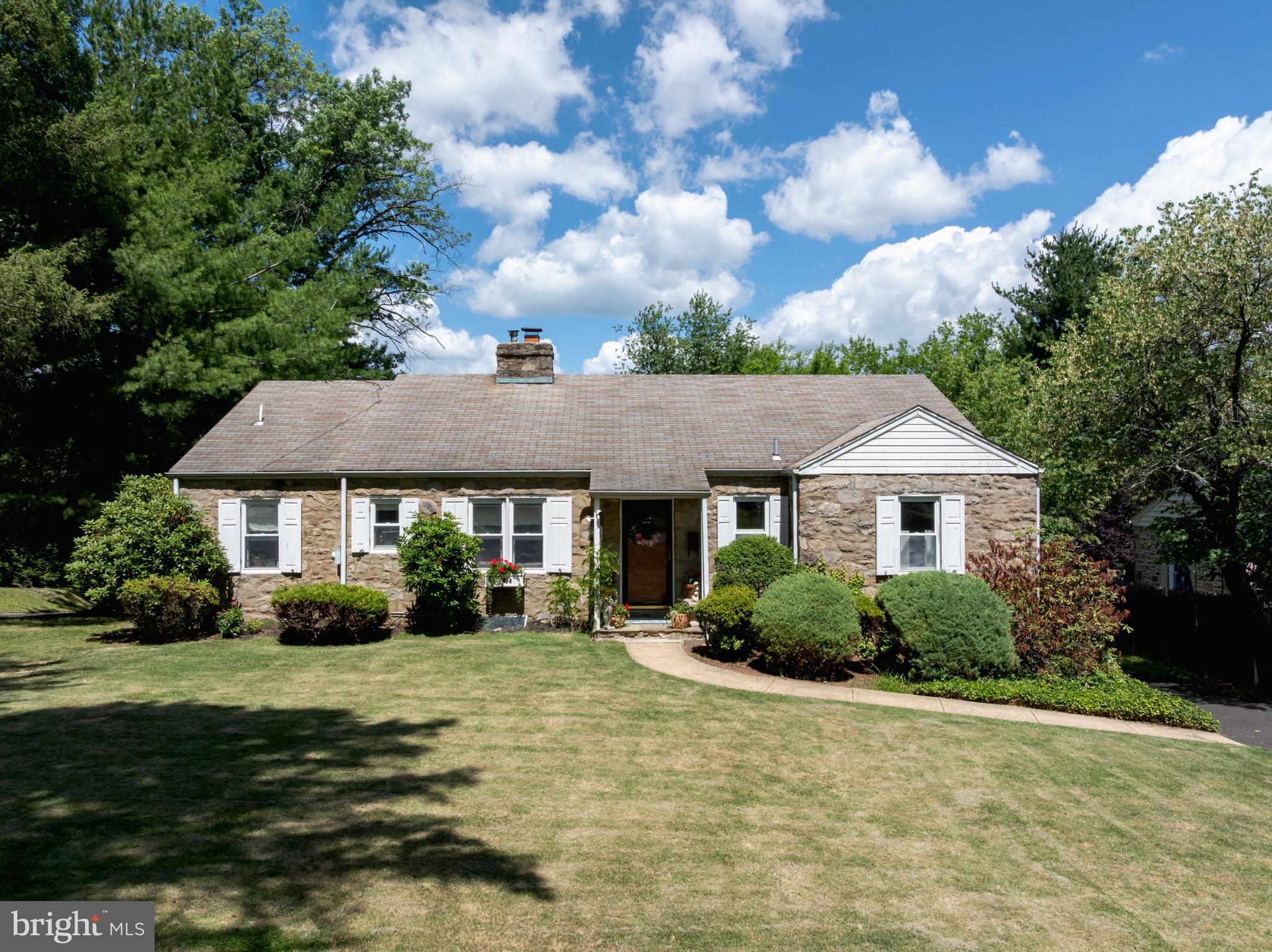 Beautiful  4 Bedroom 3 Bath Stone Cape With Pretty Hardwood Floors and Built-Ins.   First Floor Features Elegant Living Room With Fireplace , Formal Dining Room, Eat In Kitchen, Family Room, Two Bedrooms and 2 Full Baths.  Charming Covered Patio Overlooking Lovely Lot . Second Floor Offers 2 Additional Bedrooms, Sitting Room and Full Bath.  Hardwood Floors and Built- Driveway Offers Plenty of Off Street Parking Plus Two Car Garage.
