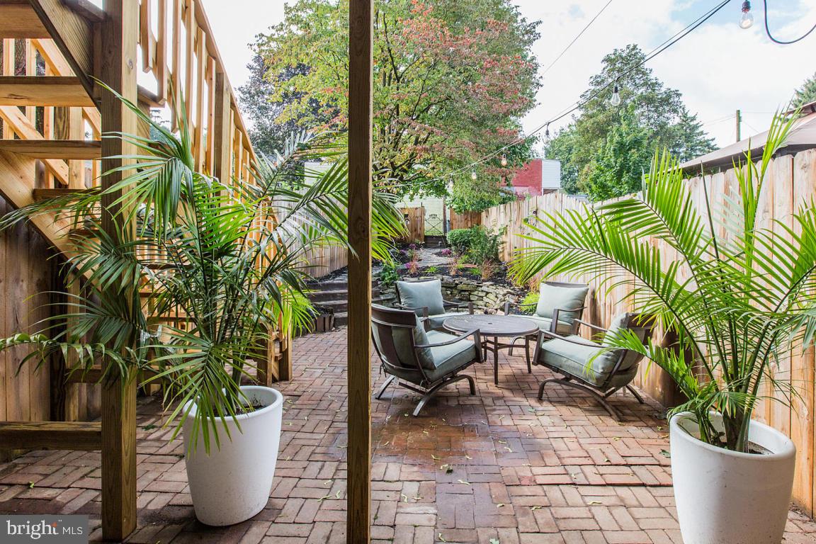 This ''Flawless Facade'' designed house must be seen! Totally renovated top to bottom inside and out. This 3 bedroom 3 bath home (1 full, 2 half) has everything you could want in a city home. Home boasts a mix of refinished hardwood and top of the line Mannington luxury flooring, a gorgeous new kitchen with granite counters and marble backsplash, stunning baths w custom vanities, a second floor laundry and truly high end fixtures throughout. The master bedroom is an oasis in the city overlooking an enchanted rear yard. A/C has been installed but you will want to spend all your time in the backyard that is the envy of the neighbors! As an extra bonus there is off street parking!