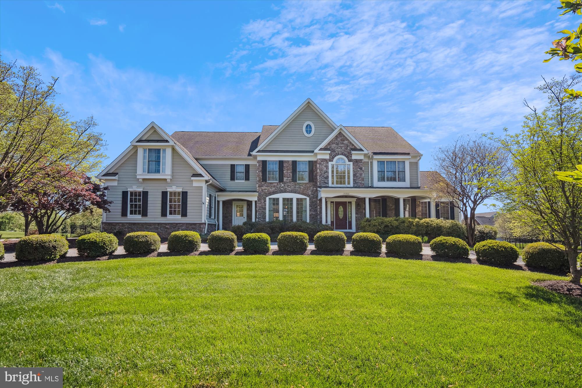Get ready to be wowed! Nestled on a sprawling, perfectly level acre, this stunning stone front estate is an absolute dream! Picture yourself pulling into the elegant semi-circle driveway and parking with ease in the convenient side-load three-car garage. Step inside and prepare to be bathed in the warm glow of gleaming hardwood floors that flow effortlessly from one gorgeous room to the next! The dramatic two-story great room will take your breath away, anchored by a cozy gas fireplace that seamlessly opens to a spectacular, sun-drenched gourmet kitchen – the perfect spot for creating memories and hosting unforgettable gatherings!  Upstairs, discover your own private oasis in the posh master suite, complete with an abundance of closet space and a luxurious primary bath that will make you feel like you're in a five-star spa!  But wait, there's more! The finished basement is an entertainment paradise, boasting a fantastic recreation area, a fun-filled game room, and a home theatre where movie nights will never be the same! Plus, there's a convenient 5th bedroom and a full bath – ideal for guests or a growing family! Don't miss out on experiencing all this home has to offer! Click on the camera icon right now to take a virtual floor plan walk-through tour – you won't be disappointed!