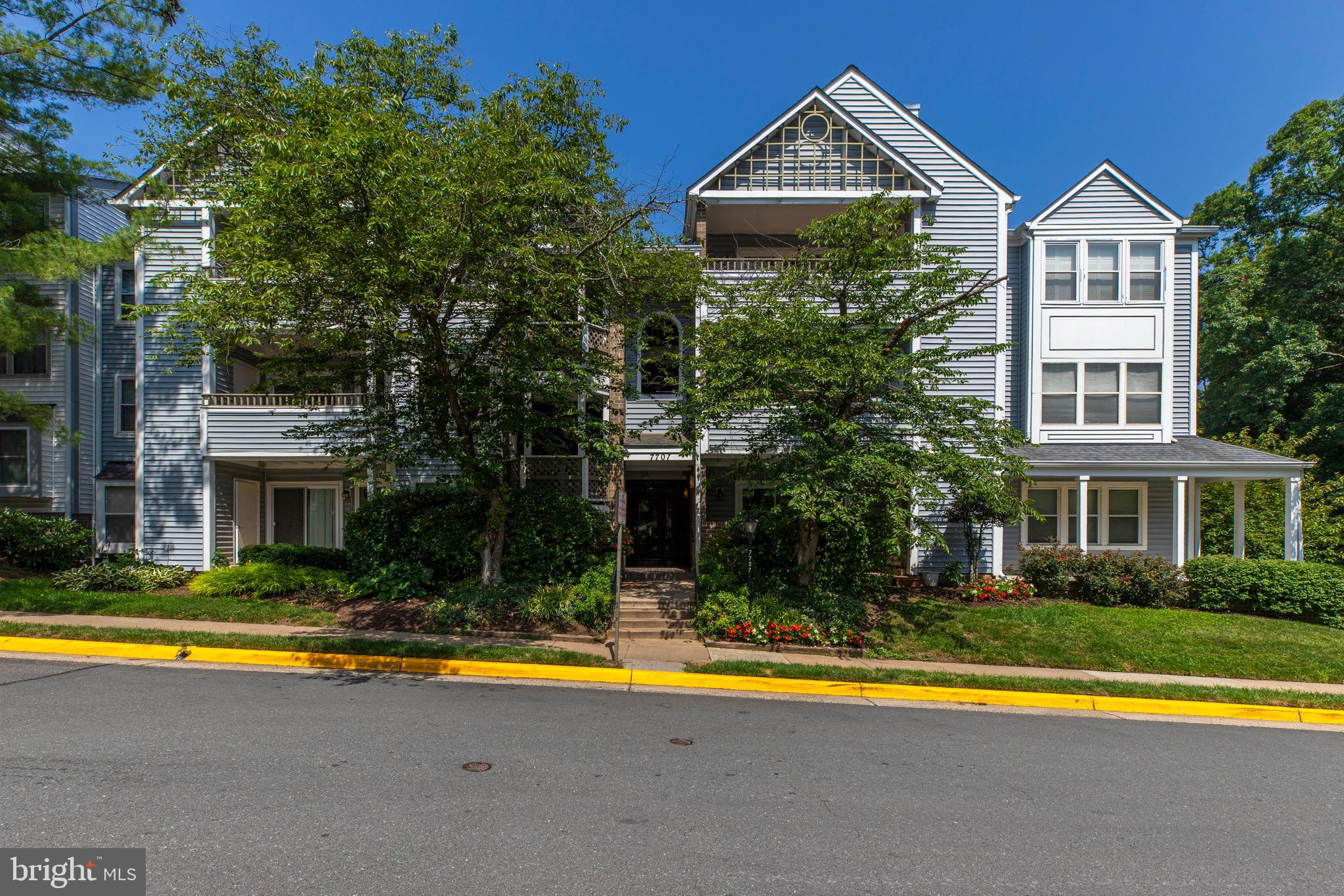 Beautifully maintained 2-bedroom, 2-bath condo featuring an open floor plan, abundant natural light, a cozy fireplace, updated kitchen, and spacious primary suite with a walk-in closet. Enjoy a private balcony overlooking mature trees and the convenience of an in-unit washer and dryer. Ideally located inside the Beltway with easy access to I-495, shopping, dining, and commuter routes. Community amenities include a pool, tennis courts, and ample parking.
