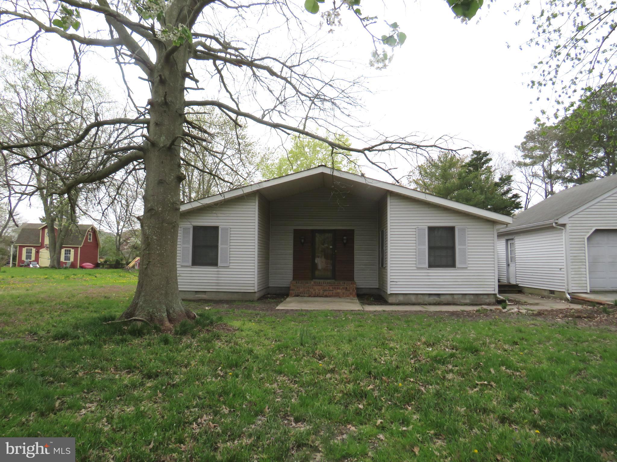 Great location, great bones to work with in this contemporary mid century home.  Slate entry, sunken living room and family room with vaulted beamed ceilings, TWO brick fireplaces, one with propane insert, the other with a pellet stove.  Large kitchen, formal dining room, three bedrooms, two baths. Detached two car garage in good condition.  House  needs some updating to make it a truly great home!  Pool and deck area need to be removed, outbuildings are in very poor condition, need removal.  Property is sold "AS IS", seller will not do any repairs. Inspections are for buyer information only.  Propane space heaters, electric baseboard units and central air.  Bring your imagination for renovation!  Will not qualify for FHA or VA.