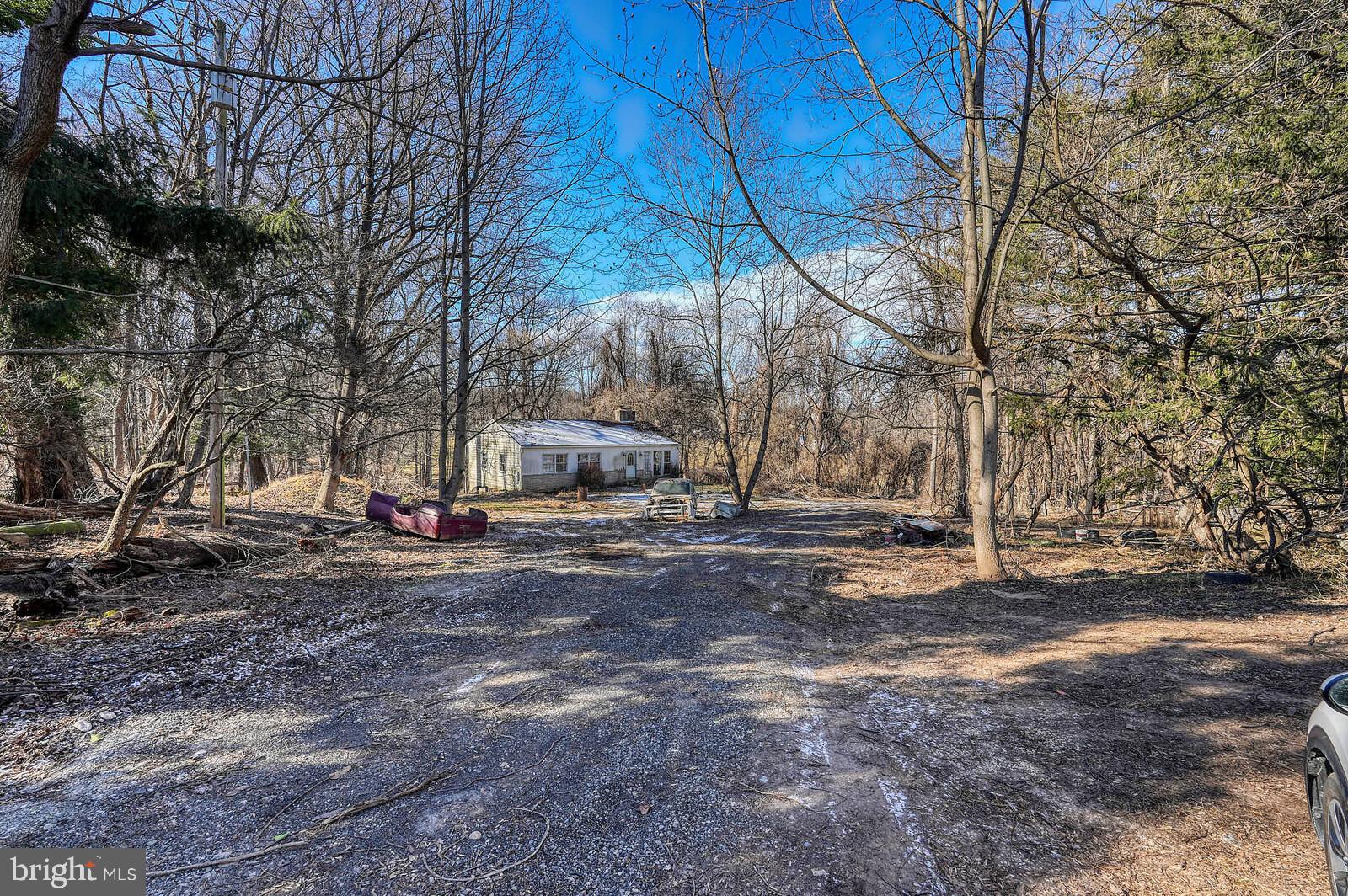 Do not enter the property without signing the hold harmless document found in the disclosures. Beautiful lot backing to creek and trees. Very private and surrounded by estate homes.  If you are ready to build your dream home, this is the one. Easy access to Route 200, Route 95, and Route 29. This home has a well and a septic system that the county says is very old and not up to today's standards. We believe public water is at the top of the driveway. Trying to verify with WSSC.  A new perc test may be needed. There is an abandoned house. Enter only after signing the hold harmless. Utilities are at the property. Buyers must do their due diligence. This lot is sold strictly as is. What you see is what you get. My county contact is Kim Beal.