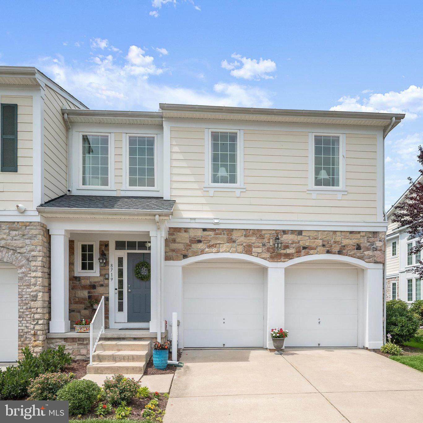 End Unit with DUAL Primary Suites (plus a 3rd Bedroom) and a Rear Patio! Nestled within the highly sought-after Snowden Overlook 55+ community, this exceptional residence offers a vibrant, resort-style lifestyle with access to outstanding amenities, including a clubhouse, swimming pool, tennis courts, and beautifully maintained common grounds. Ideally located near Wegmans, Trader Joe's, Target, a wide variety of restaurants, shopping destinations, Downtown Columbia, and BWI Airport, this home combines luxury living with everyday convenience. Arrive by way of the welcoming front entrance or attached two-car garage and experience a thoughtfully designed floor plan enhanced by rich hardwood flooring and elegant architectural details throughout. The gourmet kitchen is a chef's delight, featuring a two-tier center island with breakfast bar, granite countertops, stainless steel appliances, decorative tile backsplash with glass inlay, double oven, and 42-inch glazed cabinetry with soft-close drawers and doors. Designed for both everyday living and entertaining, the grand living room showcases soaring ceilings, a Palladian window that fills the space with natural light, crown molding, a gas fireplace with stone surround, and seamless access to the covered patio. The main-level primary suite serves as a private retreat, highlighted by plush carpeting, chair rail detailing, a spacious walk-in closet, and a luxurious en-suite bath offering a soaking tub, separate vanities, and a glass-enclosed walk-in shower. The upper level continues to impress with a versatile loft area ideal for a lounge, game room, reading nook, or additional living space. A spacious bedroom suite features abundant natural light, chair rail accents, a sitting area, a Palladian window, a walk-in closet, and a private en-suite bath complete with a soaking tub, double vanity, private water closet, and glass-enclosed walk-in shower. An additional bedroom suite provides comfortable accommodations for family and guests alike. The fully finished lower level expands the home's living space with a large family room, wet bar, luxury flooring, plush carpeting, generous storage areas, a full bath, and a flexible bonus room perfect for a hobby room, home office, fitness area, or potential guest bedroom. Step outside from either the grand living room or the primary suite to enjoy a covered patio that flows effortlessly to an extended patio, creating the perfect setting for outdoor dining, entertaining, or simply unwinding amidst beautifully landscaped surroundings. Offering abundant flexible living space both inside and out, this exceptional home perfectly balances luxury, comfort, and the ease of active-adult living. With spacious interiors, resort-style amenities, and an unbeatable location close to shopping, dining, entertainment, healthcare, and recreation, this remarkable Snowden Overlook residence offers the very best of 55+ living. Dual Zoned Heating and Cooling.  Both HVAC systems were completely replaced in 2021. Water Heater (2021).