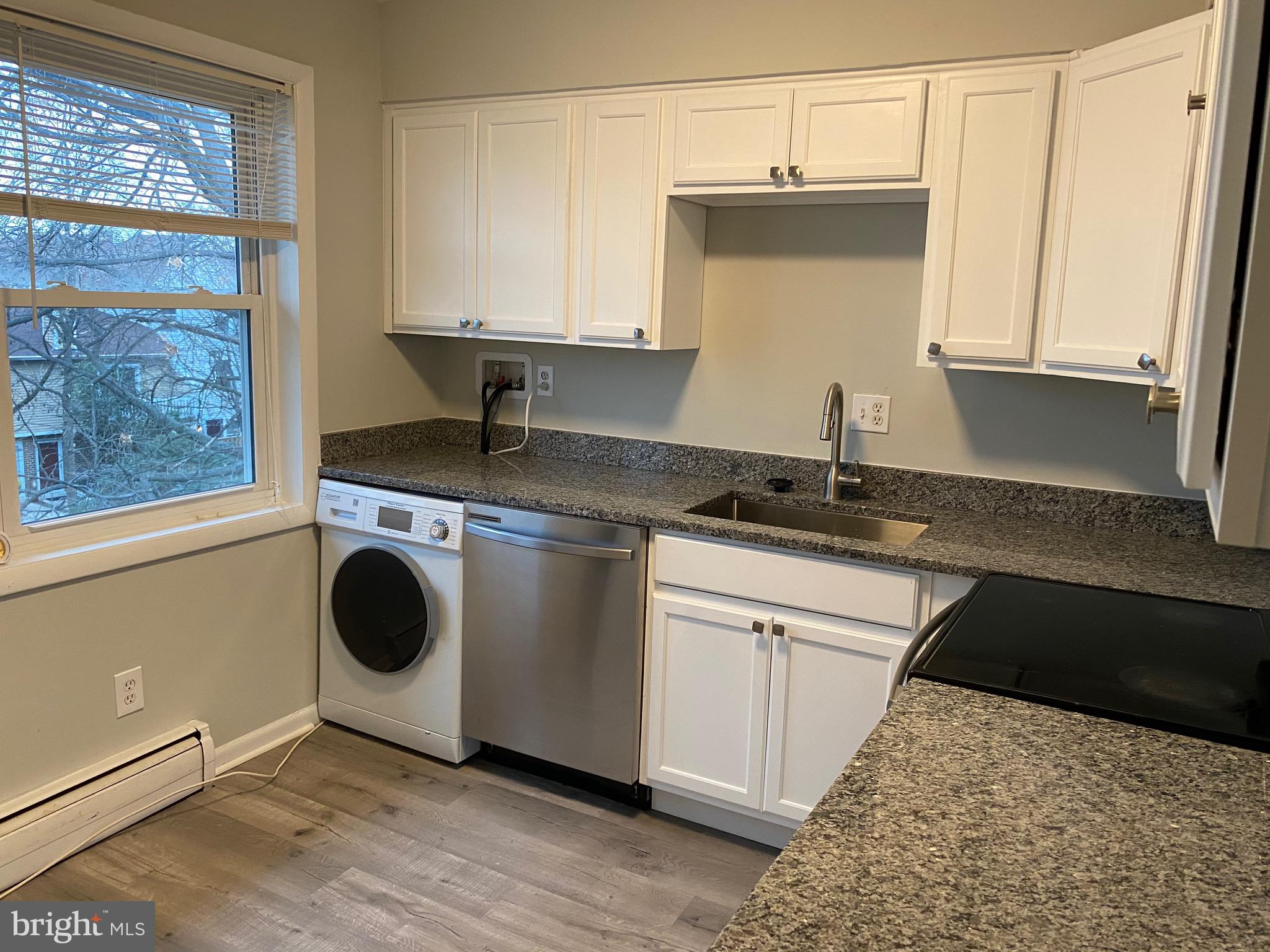 One Bedroom Condo on top level with balcony overlooking back of building. Hardy plank floors through out.  Top floor unit with new Washer & Dryer, GE flat surface stove and Dishwasher. Hardy plank floors, Stainless refrigerator, white cabinets and granite countertops in kitchen were replaced in 2023.  All utilities included in Condo fees except internet, cable or telephone.