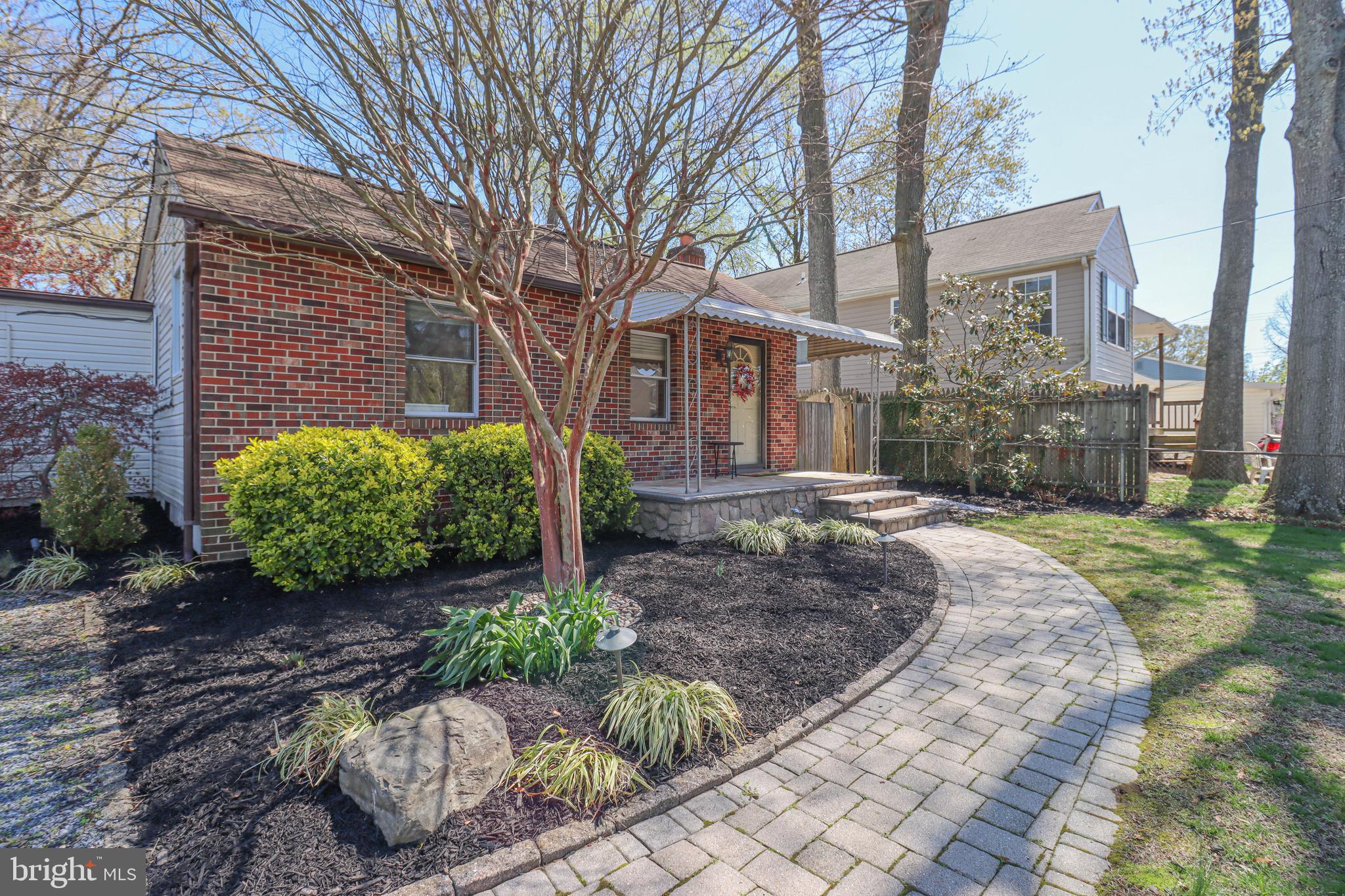 Charming One-Level Gem in a Water Privileged Community! Welcome to this beautifully maintained home, tucked away from the street, offering the perfect balance of comfort, style and privacy. Designed for effortless living, the seamless one-level layout ensures easy accessibility and a warm, inviting atmosphere throughout.
Step inside to discover an updated kitchen that’s both functional and inviting, complete with newer stainless steel appliances, countertops, backsplash, and a built-in table and bench seating featuring convenient storage underneath.  
The serene oasis of the exterior is equally impressive, with extensive hardscaping and lush landscaping with low voltage uplighting throughout creating plenty of privacy from the inside of the home.  Whether you're hosting a summer barbecue on the built in grill or enjoying a quiet evening under the stars around the fire pit, this outdoor space has it all. 
Additional exterior highlights include bonus living space in the finished shed equipped with a mini split system and a loft large enough for a queen-size mattress. Plus two more storage sheds—one dry storage and another for yard equipment—keeping your outdoor space neat and organized.
Enjoy the perks of water privileges with access to five sandy beaches, boat ramps, fishing and crabbing piers, playgrounds, and picnic areas. Need space for a gathering? The community clubhouse on Mayo Road is perfect for hosting events. Boat owners will love the affordable marina access—dock your boat for just $15/ft per year!
Don't miss your chance to call this versatile, picturesque property home. Includes a 1-year home warranty