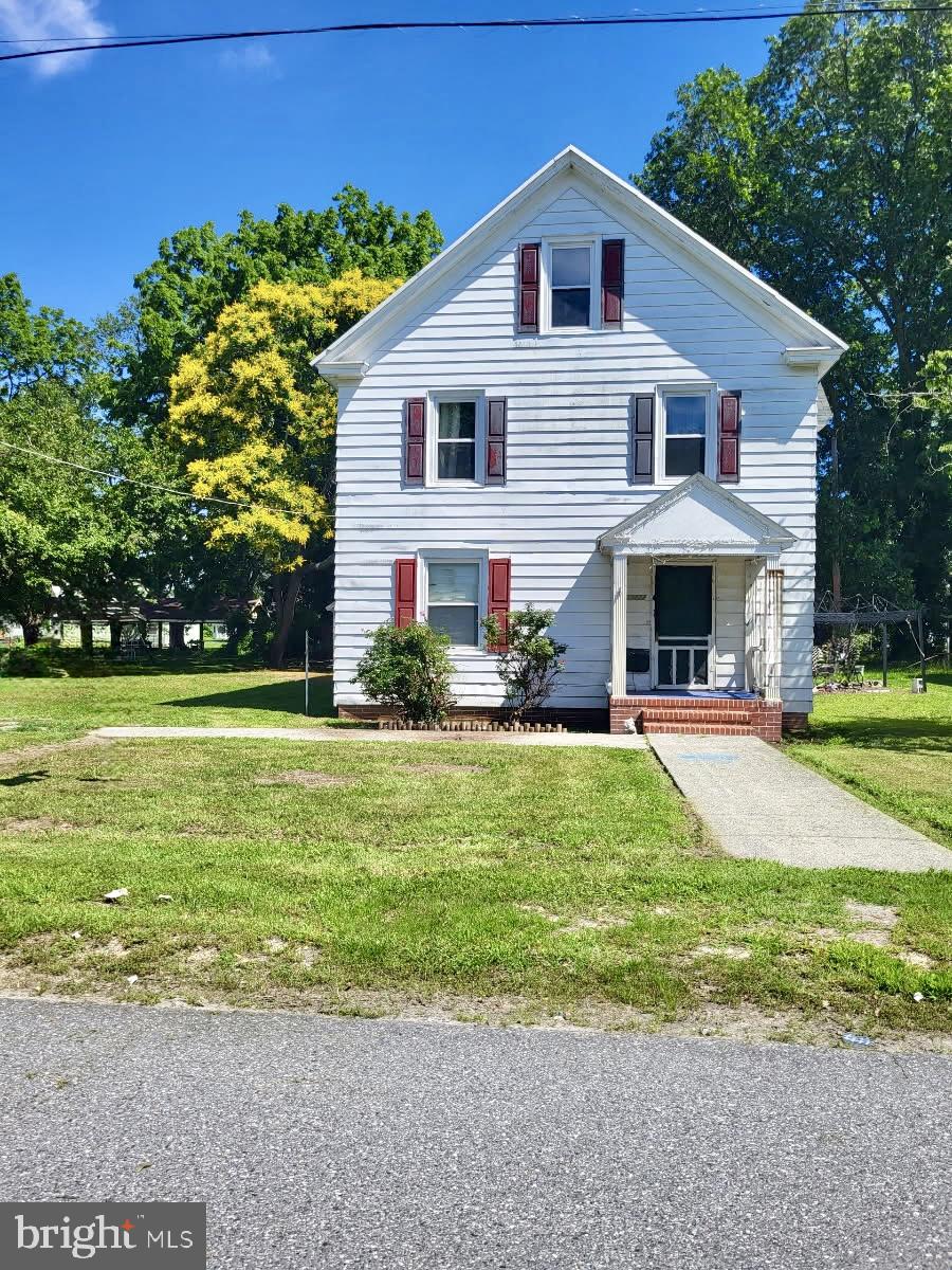 Huge price adjustment, a lot of house for the value. Waiting on the new owner  to recognize the work that has been done to this grand lady. Up-dates have included central air and heat, dual zone, and new windows, just to name a few. The original hardwood floors are under the carpet. Large rooms and an eat in kitchen with a screened porch off the back. Rare for in town a nice garage for tools and lawn equipment. The home just needs some TLC to be back to the lovely home it can be. This may be an assumable VA loan.