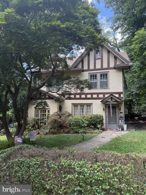Nestled in a serene setting, this exquisite Tudor-style residence, built in 1907, offers a harmonious blend of timeless elegance and modern comfort. Spanning over 2,200 square feet, this charming home invites you to experience a lifestyle of luxury and tranquility. As you approach the property, the stunning stucco exterior and classic architectural details create an inviting first impression. The expansive lot, encompassing 0.76 acres, provides ample space for outdoor activities and gardening, while the meticulously maintained grounds enhance the overall allure of this distinguished home. Step inside to discover a warm and inviting interior that exudes character and charm. The spacious layout features four generously sized bedrooms, perfect for accommodating guests or creating your own personal retreat. The thoughtfully designed living spaces are bathed in natural light, highlighting the intricate craftsmanship and unique architectural elements that define this residence. The well-appointed kitchen, though not detailed here, offers the potential for culinary creativity, making it a delightful space for preparing gourmet meals. With one full bathroom and an additional half bath, convenience is at your fingertips. The laundry area adds to the practicality of daily living, ensuring that chores are handled with ease. For those who appreciate the finer things in life, the property boasts an impressive eight-car attached garage, providing ample space for vehicles and hobbies alike. The front-entry garage design adds to the home's curb appeal while ensuring that your vehicles are sheltered from the elements. While the property does not feature a pool, the expansive outdoor space offers endless possibilities for creating your own private oasis. Imagine hosting summer barbecues or enjoying quiet evenings under the stars in your beautifully landscaped yard. This residence is not just a home; it's a lifestyle. With its rich history, elegant design, and generous amenities, it invites you to create lasting memories in a setting that feels both luxurious and welcoming. Experience the perfect blend of classic charm and modern convenience in this exceptional Tudor home, where every detail has been thoughtfully considered to enhance your living experience.