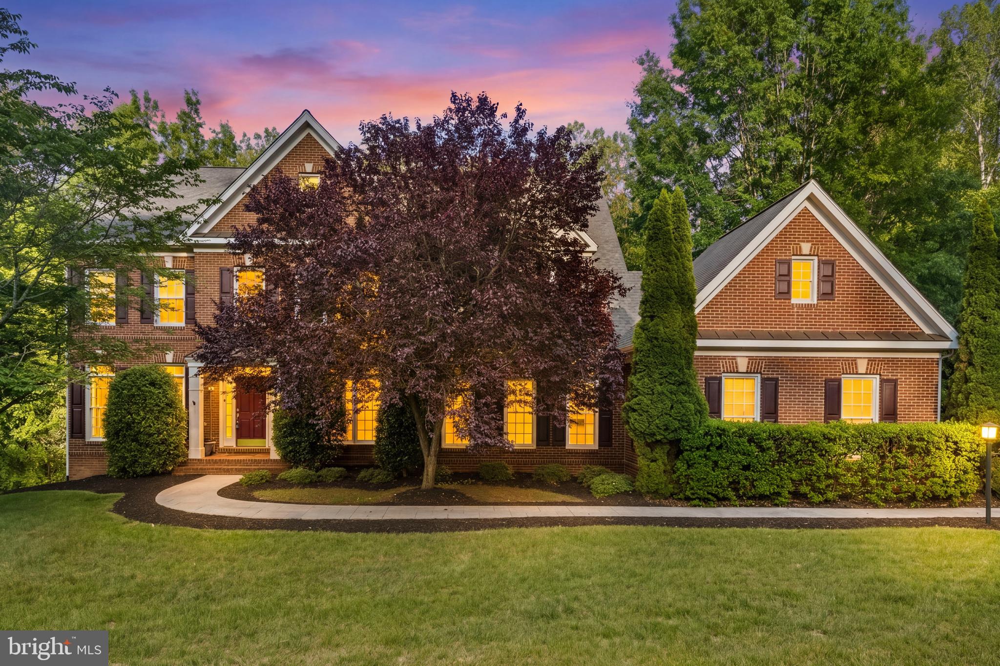 Welcome home to 11019 Bacon Race Rd! This stunning executive residence is perfectly positioned on a private 3+ acre homesite within the exclusive Cloisters enclave. Thoughtfully designed for both elegant entertaining and comfortable everyday living, this exceptional home features 5 spacious bedrooms, 5.5 baths, 2 fireplaces, and a rare main-level bedroom suite ideal for guests or multigenerational living. The flowing floor plan blends refined spaces with inviting warmth, creating the perfect balance of luxury and livability. 

Cook, gather, and entertain in the gourmet kitchen featuring abundant prep space, white cabinetry, granite countertops, and an oversized entertainer’s island. The kitchen seamlessly opens to the inviting sunroom, while the dramatic two-story vaulted great room showcases a gas fireplace, plenty of large windows letting in an abundance of natural light and brand new carpet. Enjoy surround sound throughout the main level and outdoor living spaces, creating the perfect atmosphere for entertaining both inside and out. 

Upstairs, the spacious primary suite offers a relaxing sitting area highlighted by an elegant circular window area, creating a luxurious private retreat. The spa-inspired en-suite bathroom features a large soaking tub, glass-enclosed shower, and separate sink vanities. Three generously sized secondary bedrooms provide exceptional comfort and flexibility, including one with its own en-suite bath and two connected by a Jack-and-Jill bathroom, ideal for family or guests. 

The walk-out lower level is an entertainer’s dream, featuring a wet bar, billiards room, expansive recreation area, and an additional full bathroom, all with direct access to the covered and side patios for seamless indoor-outdoor entertaining.  Step out to the rear patio where a private hot tub overlooks the serene, peaceful acreage—offering the perfect setting to unwind and take in the surrounding natural beauty. 
A beautifully landscaped lawn with a welcoming pavered entry path sets the tone for this exceptional property. A true car enthusiast’s delight, this home is perfectly suited for collectors, remote professionals, or households with multiple drivers. The attached 3-car garage is complemented by a remarkable detached 3-car, climate-controlled garage featuring 12-foot ceilings, RaceDeck flooring, and a car lift. Additional RV parking and a 50-amp electrical hookup further enhance the functionality and versatility of this well-appointed estate.  No HOA. Your search ends here!  Roof 9 years old, water heater 9 years old.  Brand new carpet in family room, main level bedroom, both staircases and upper level bedrooms.