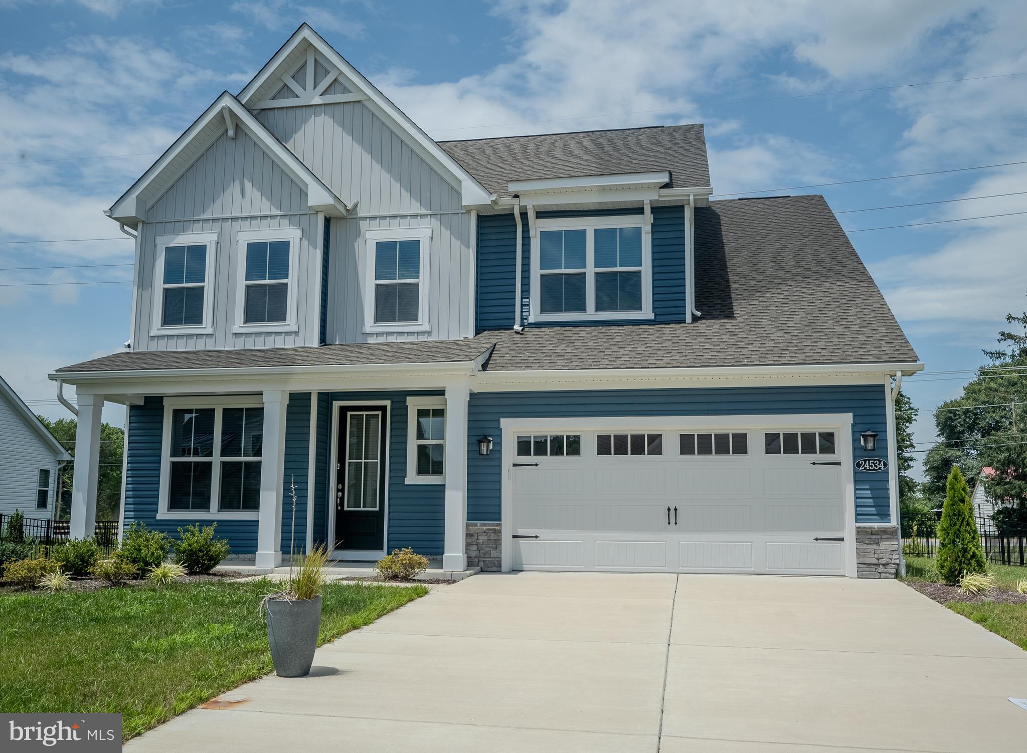 Welcome to Wetherby, where coastal inspired living meets modern comfort and thoughtful design. This beautifully upgraded Newport model offers over 3,100 square feet of living space with 4 bedrooms, 3.5 bathrooms, two primary suites, and flexible spaces designed for today’s lifestyle.
The main level features an open-concept layout with 9+ foot ceilings, a spacious living and dining area, a dedicated study, and a first-floor primary suite with a large en-suite bath and walk-in closet. The gourmet kitchen includes a gas stove, center island, ample cabinetry, large pantry, and flows seamlessly into the bright living area with an electric fireplace.
Upstairs, a second spacious primary suite features tray ceilings, dual closets, and a private en-suite bath. Two additional bedrooms and a large loft provide excellent flexibility for guests, a home office, media room, hobbies, or multigenerational living.
Recent upgrades include luxury vinyl plank flooring throughout the study, all bedrooms, and loft. Custom remote-controlled shades were installed throughout the home in May 2025, adding privacy, convenience, and a polished finish.
Energy-conscious features include a tankless water heater, two thermostats, and Department of Energy Zero Energy Ready Home certification. The two-car garage includes an EV plug-in.
Enjoy outdoor living from the welcoming front porch, rear patio, and fenced backyard. Wetherby offers community amenities including a pool, bathhouse, and pickleball courts, all just a short drive to Delaware beaches, shopping, dining, and outdoor recreation.
With upgraded finishes, two primary suites, generous living space, and no builder wait, this home is a standout opportunity in one of Millsboro’s desirable newer communities.